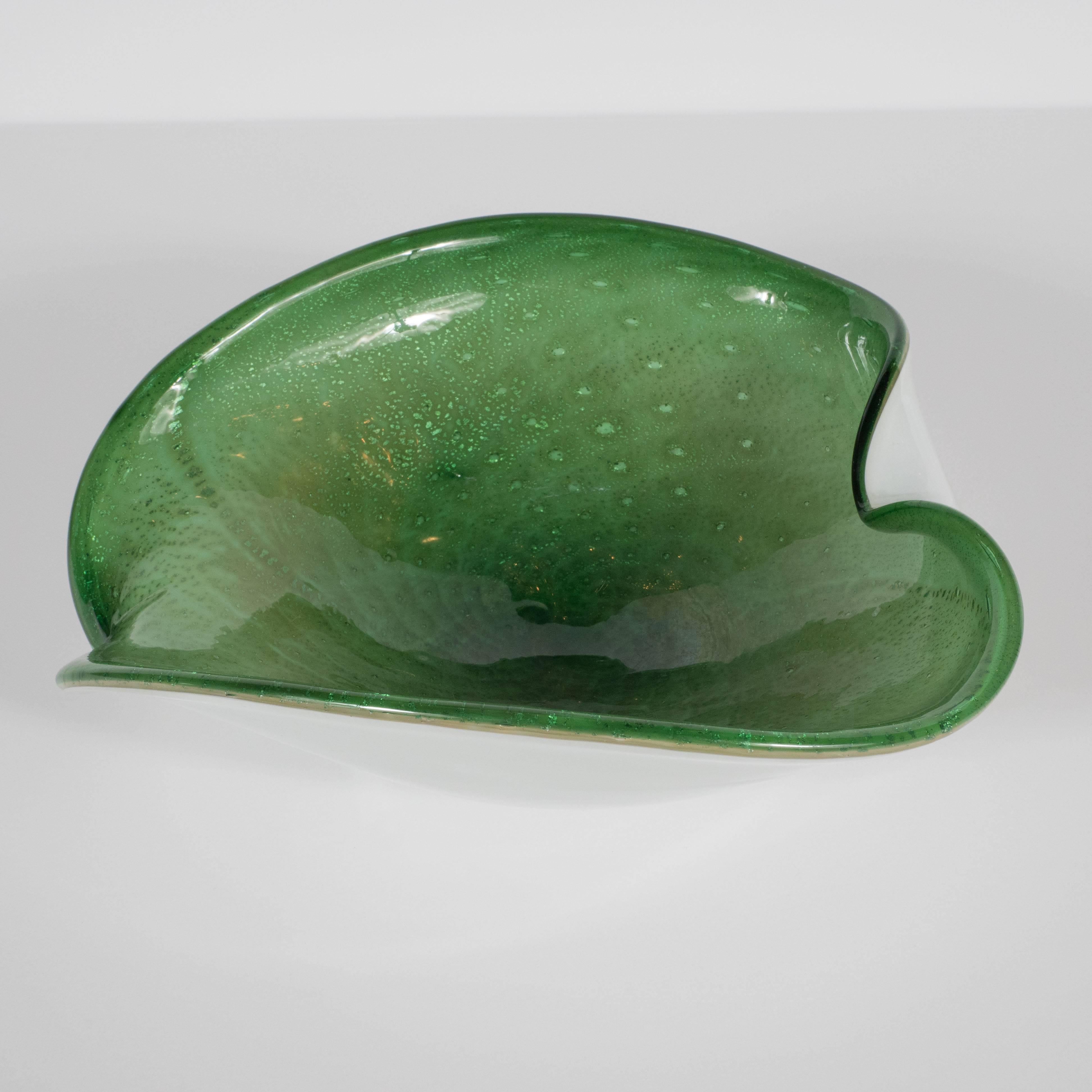This stunning bowl was handblown in Murano, Italy- the fabled island off the coast of Venice- circa 1950, employing the same techniques that artisans have used for centuries to produce the world's most revered glass products. This piece represents a