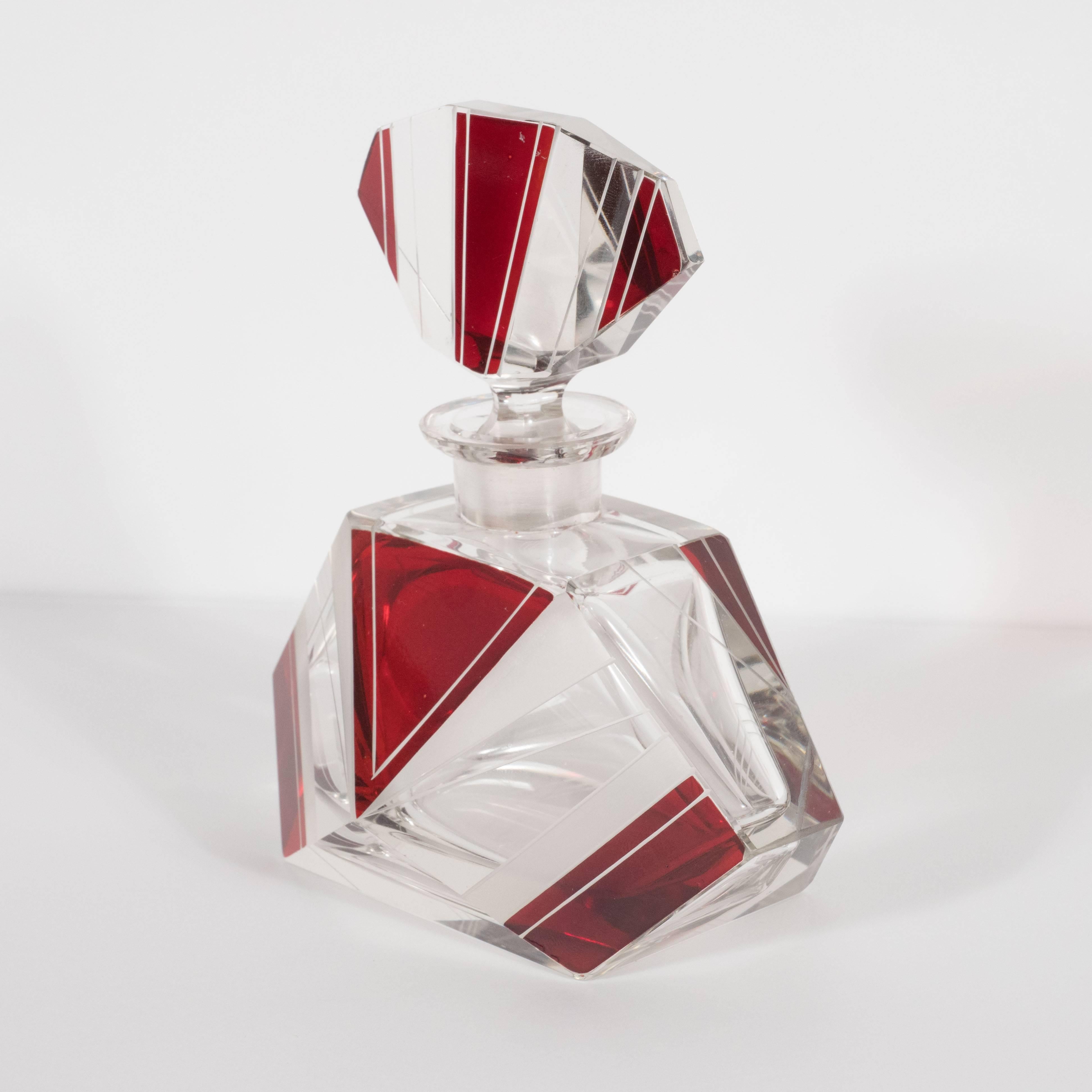 This refined cubist Art Deco perfume bottle was realized in the Czech Republic- a country renowned for its superlative glass products during this period. This piece, with its highly considered details and excellent craftsmanship, helps to explain