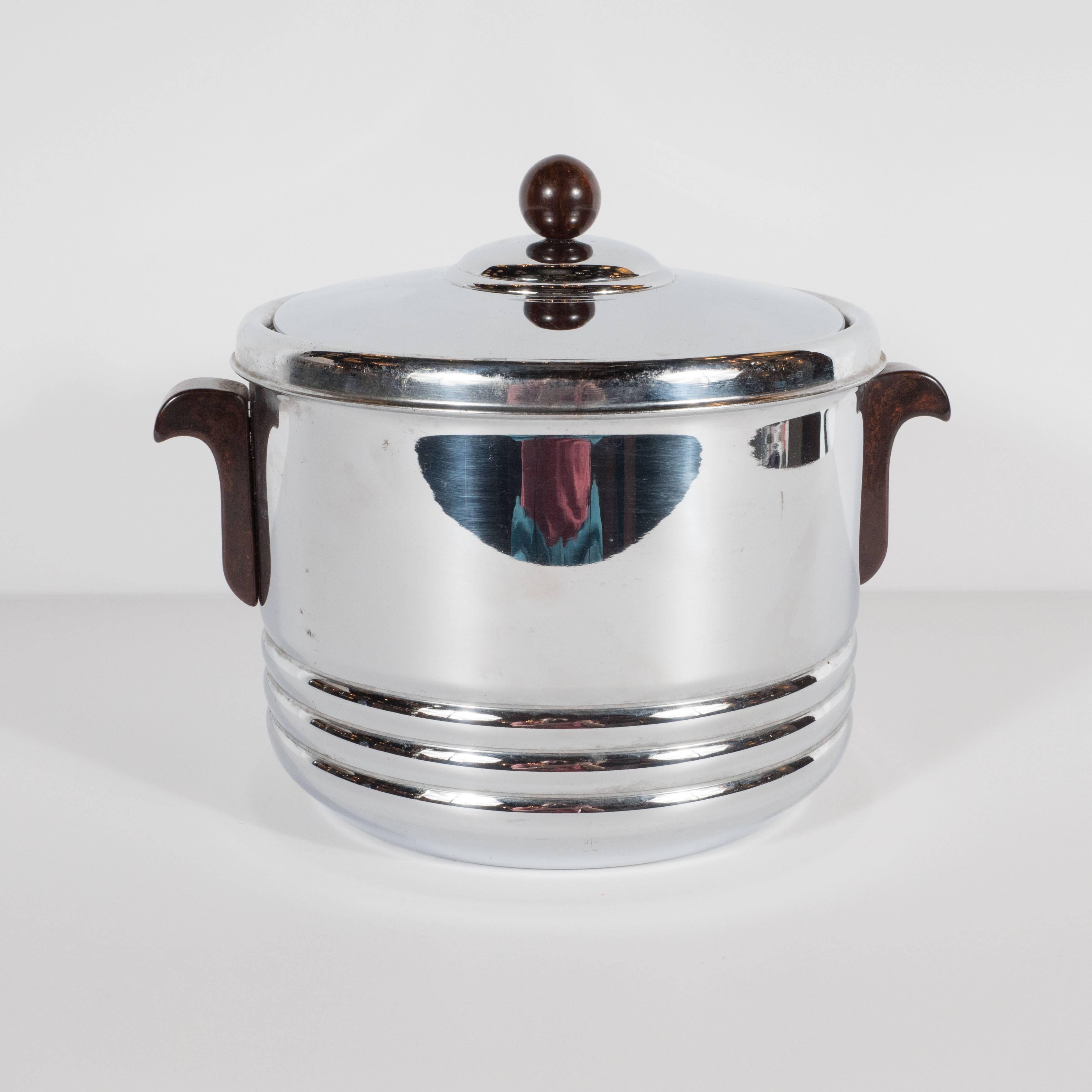 This sophisticated Art Deco has all of the distinguishing characteristics of Machine Age design in American at its finest. Constructed from lustrous chrome with a ceramic interior, the piece features the austere design that collectors of the period