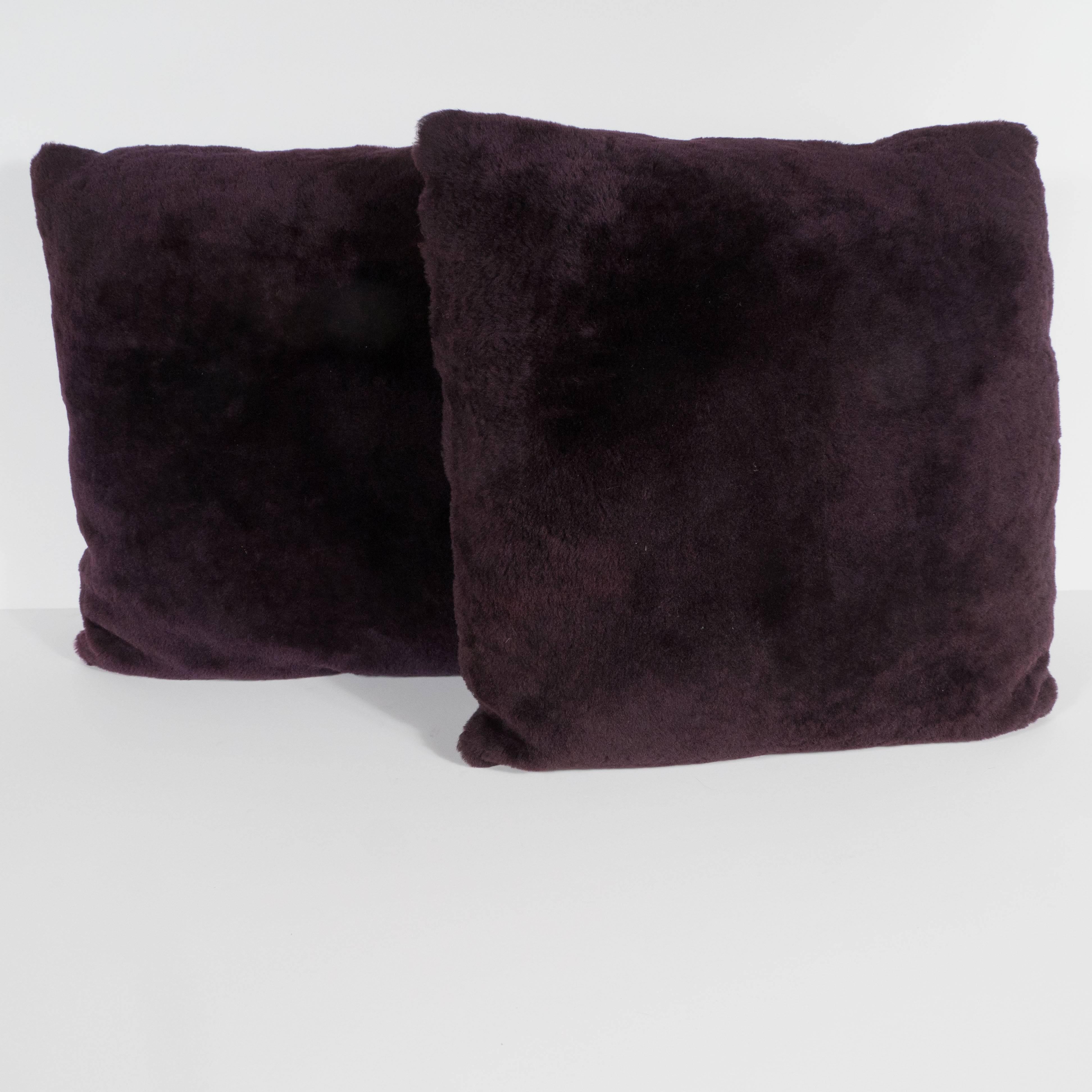 These stunning pillows have been upholstered in a luxe smoked amethyst mohair and Loro Piana cashmere. Their austere form and sumptous materials guarantee that they would be a perfect fit for virtually any style of interior from Classic Art Deco to