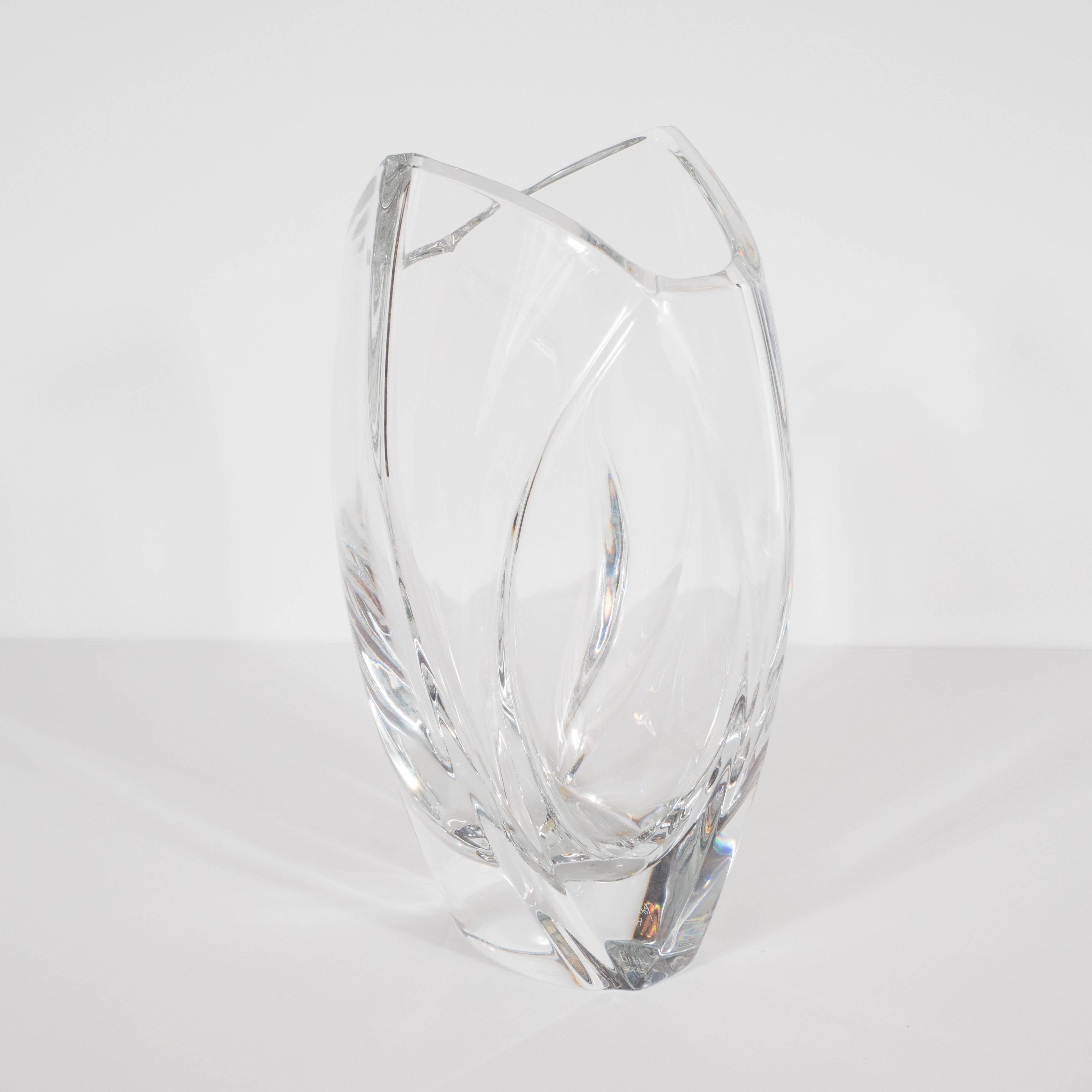 This stunning vase realized by Baccarat- one of France's most illustrious producers of glass products- circa 1970. Baccarat represented the official glassmaker for Louis XV and continues to make some of the finest handblown glass in the world. This