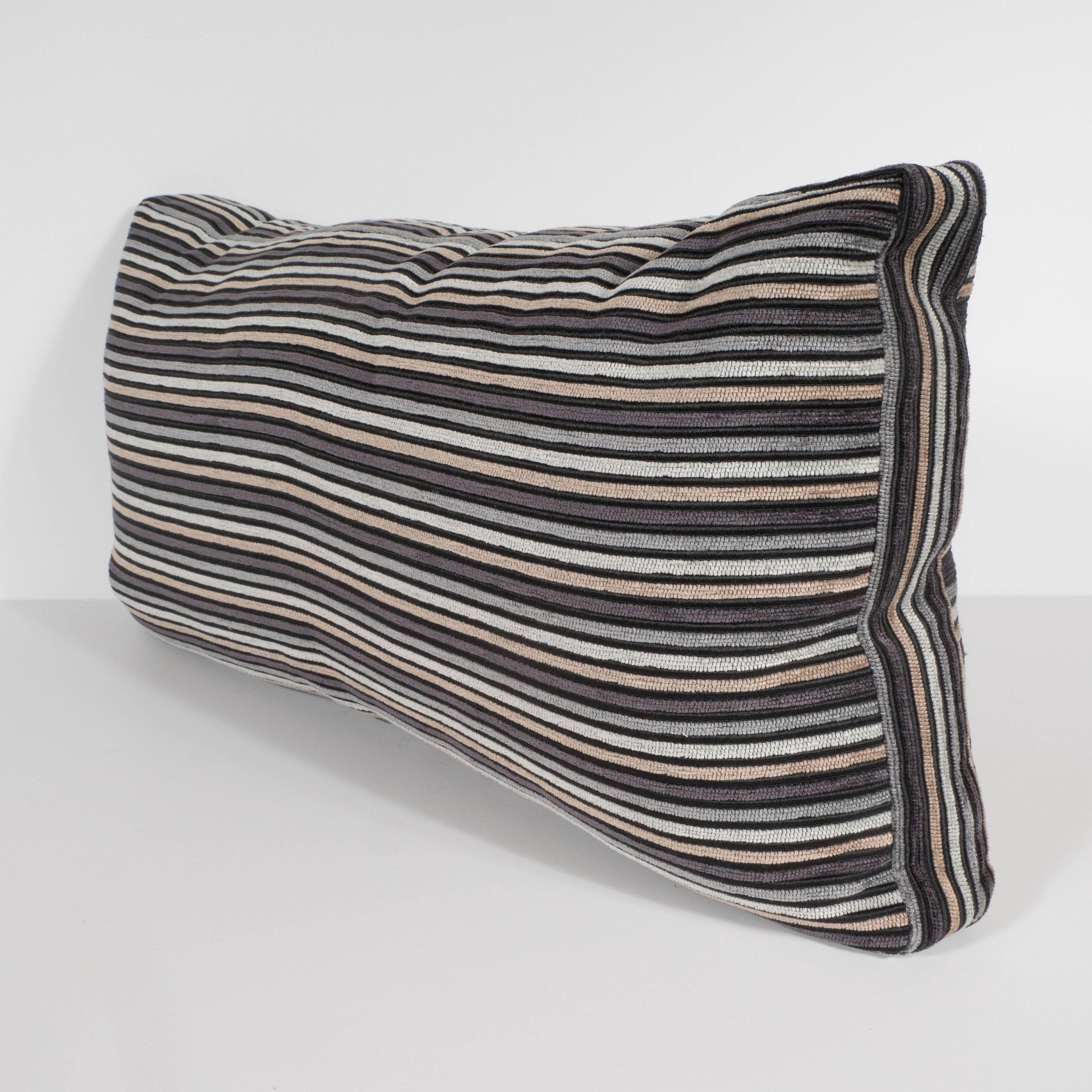 This sophisticated pair of striped rectangular pillows features hues of champagne, oyster, smoked platinum, and charcoal hues with alternating black lines. The neutral tones of these pillows would be a perfect complement to virtually any color