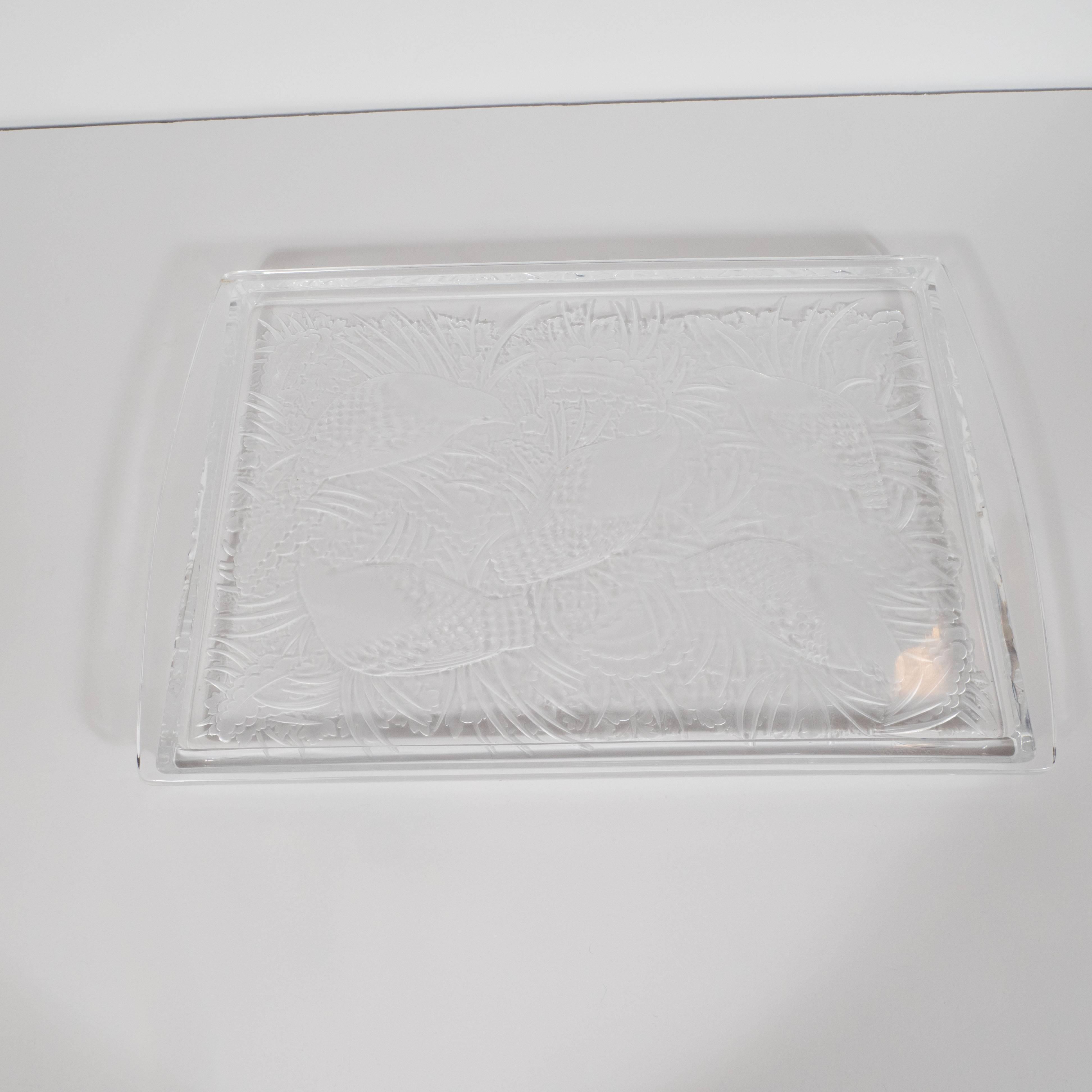 This exquisite Art Deco style tray features five quails set against an abundance of foliage in a perdrix pattern that suggests endless repetition, beyond the parameters of the rectangular tray, in the manner of M.C. Escher. The tray features raised