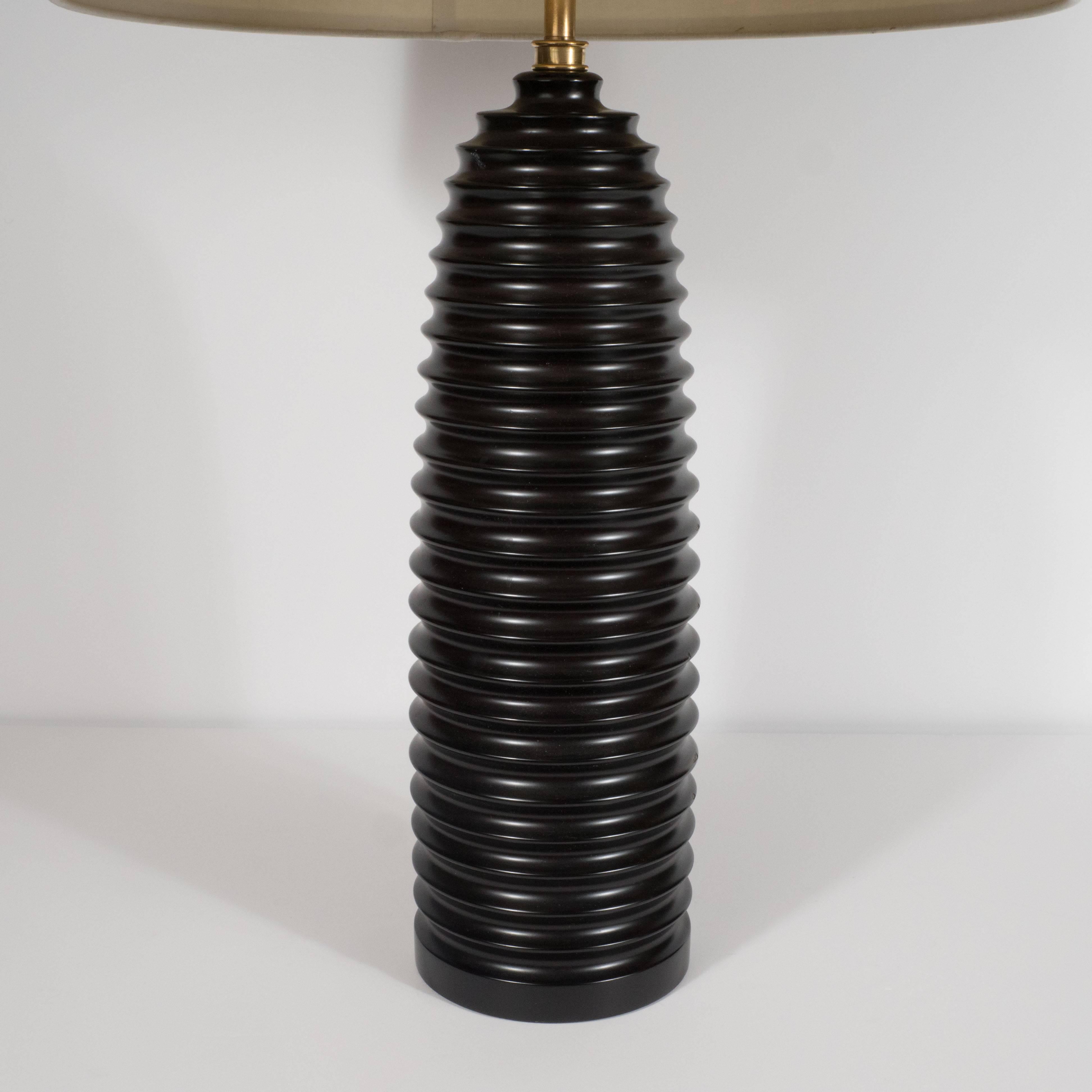 This sophisticated and understated pair of bullet lamps were realized by the esteemed California contemporary designer Marian Jamieson, who cut her teeth designing under the illustrious J. Robert Scott. These pieces testify to her refined design