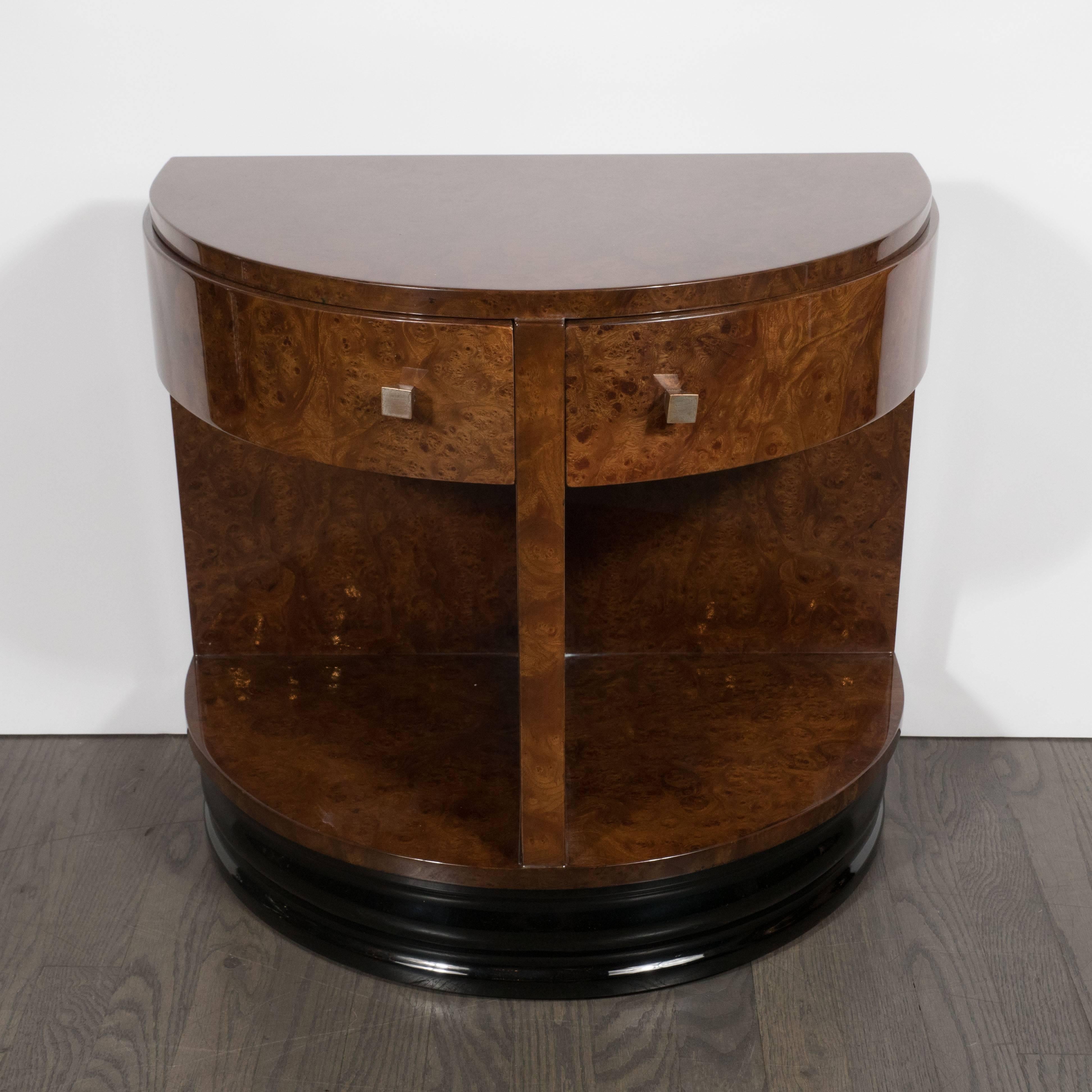 This important (and striking) side table was realized by Donald Deskey- the legendary American designer of Radio City Music Hall- for the Widdicomb Company, circa 1935. Executed in book-matched Carpathian elm- that displays a stunning natural