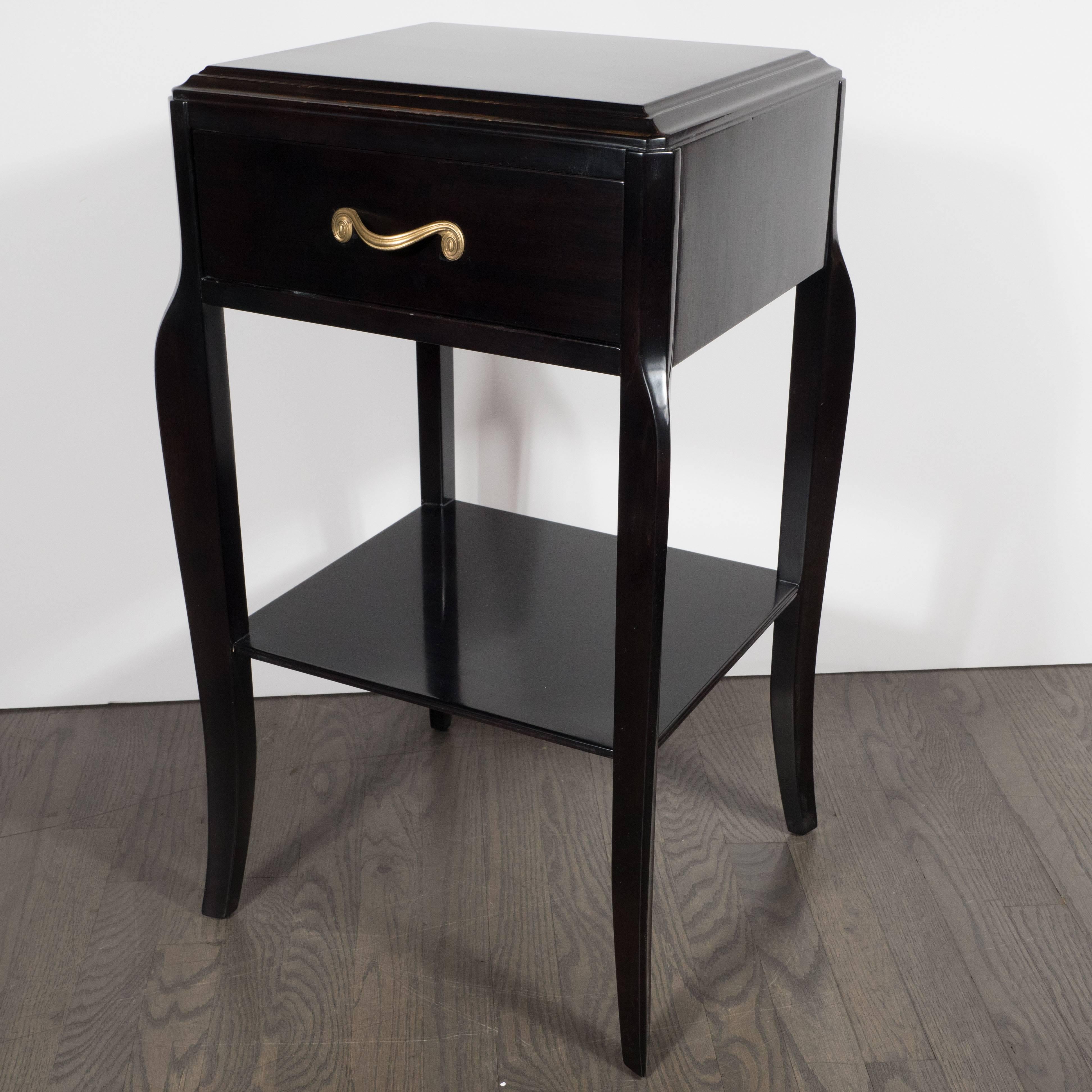American Pair of Grosfeld House Nightstands in Ebonized Mahogany with Gilded Scroll Pulls
