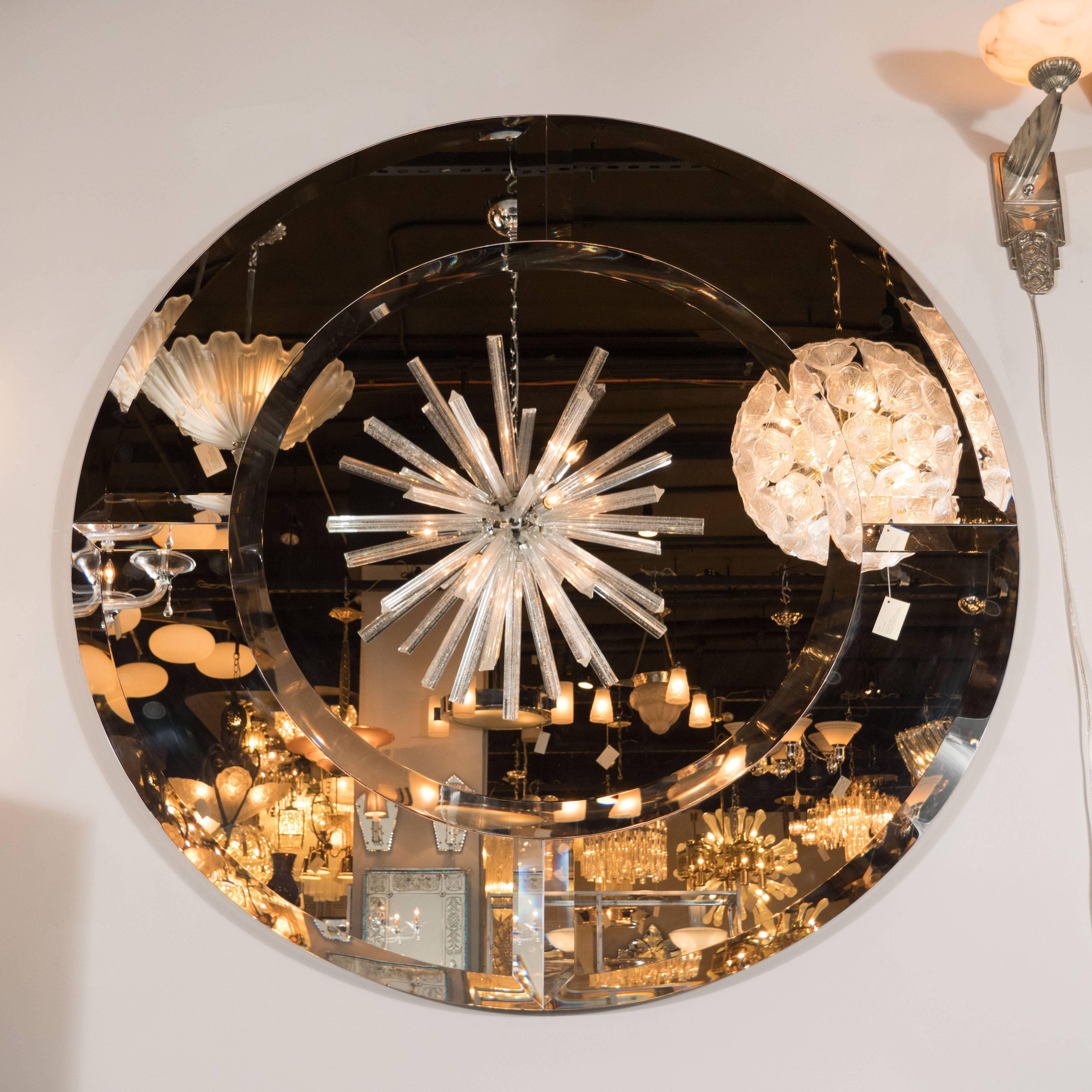 This modernist circular starfire mirror represents one of the few contemporary items that we carry at High Style Deco and for good reason. Fabricated by our custom, New York based atelier in the manner of Karl Springer it embodies the attention to