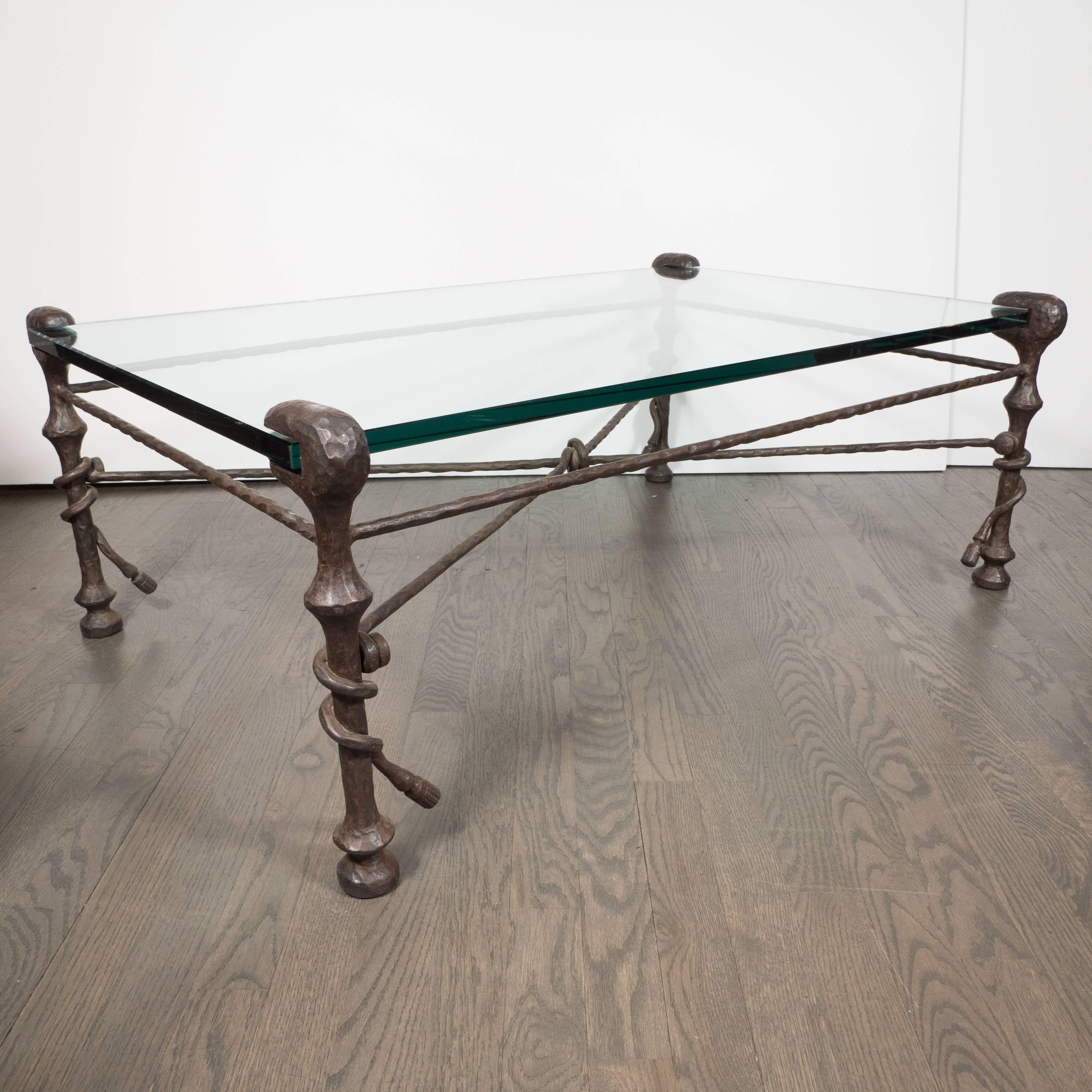 This stunning bronze table was realized in the United States, circa 1960. With its organic, anthropomorphic forms fastidiously hand crafted in bronze, this table evokes the celebrated work of Diego Giacometti. This table offers four legs with