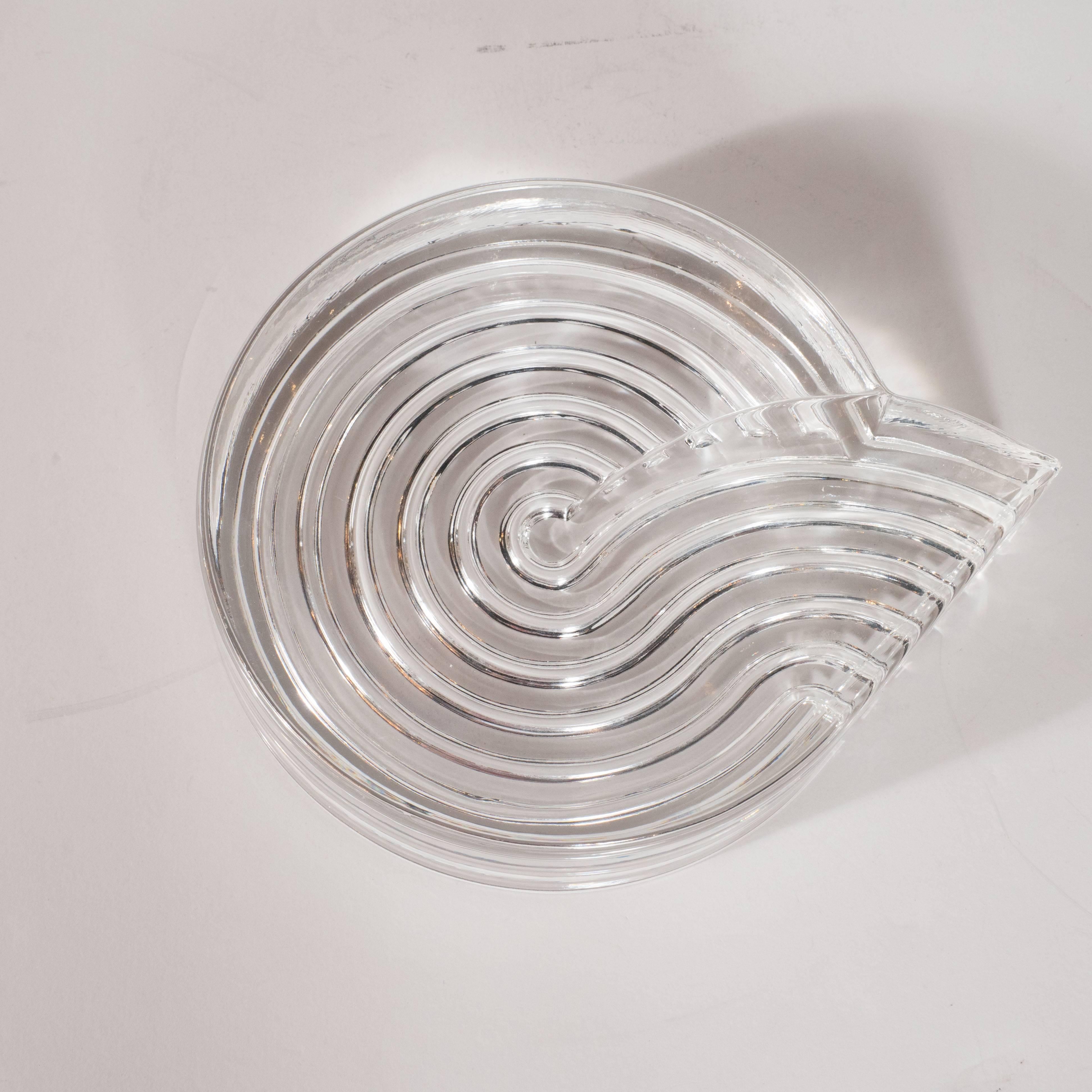 This stunning piece was created by Natale Sapone for Rosenthal- the esteemed German glass studio, circa 1980. Realized in an Art Deco revival aesthetic, this ashtray/side dish features a whirlpool form, consisting of various channels etched on the