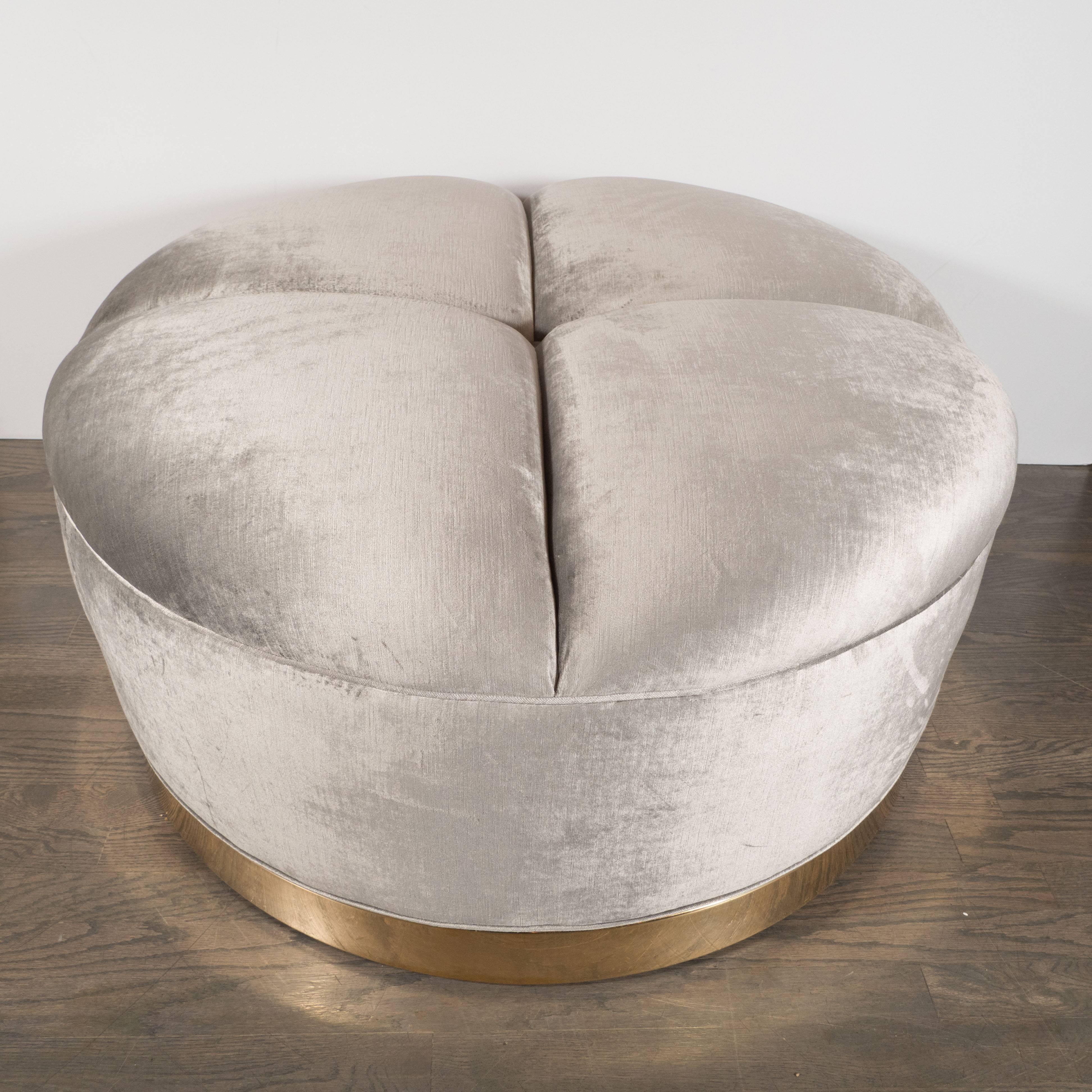 This striking Mid-Century Modern Ottoman was realized in the United States, circa 1970. With its clean lines and luxurious materials, it embodies the qualities that collectors of the period adore. It consists a four tufted cushion, segmented in