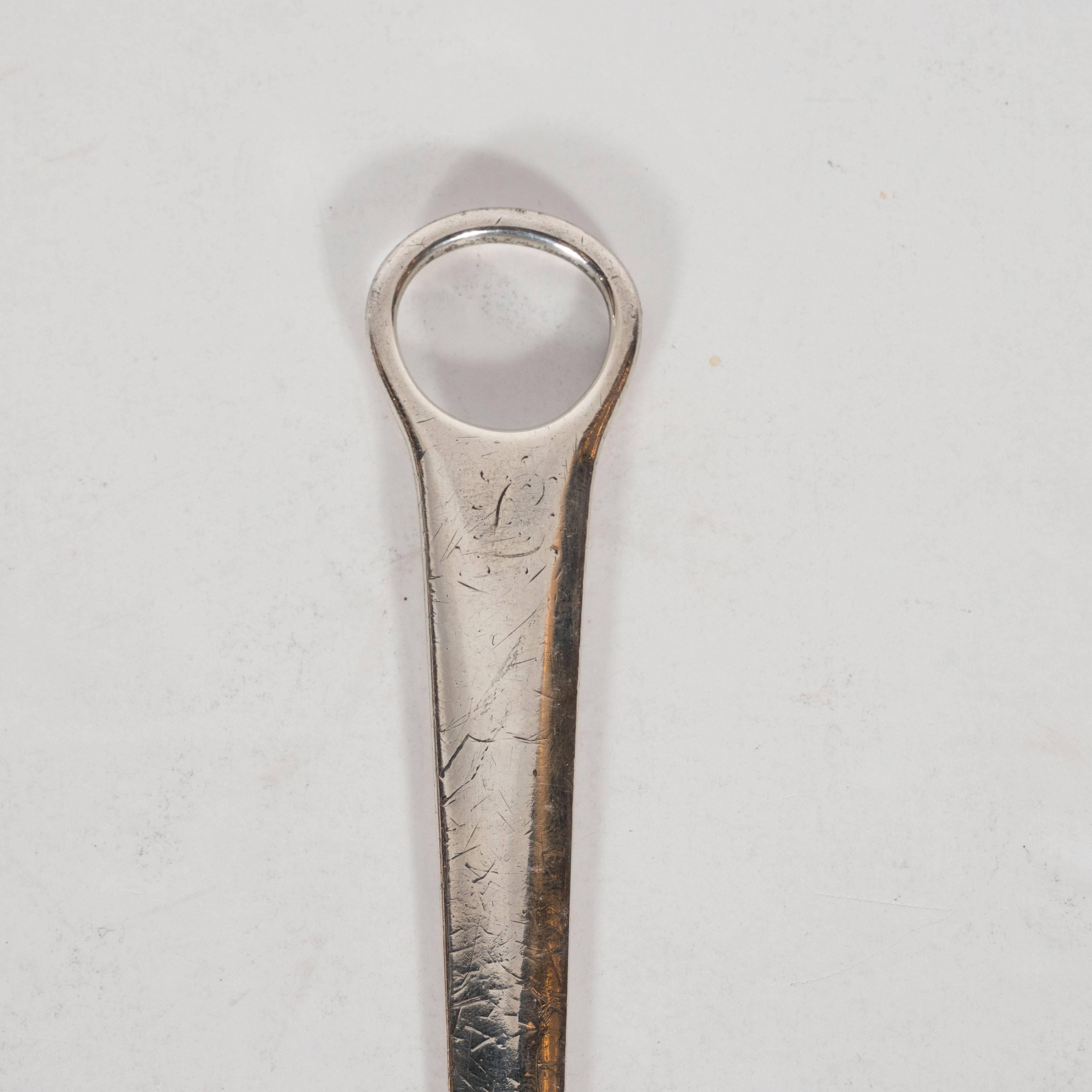 This elegant letter opener was forged by the esteemed British silversmith company Robert Cruickshank in London during the 18th century. It features an ovoid opening and a tapered and subtly bowed body that tapers to a point. The silvermarks near