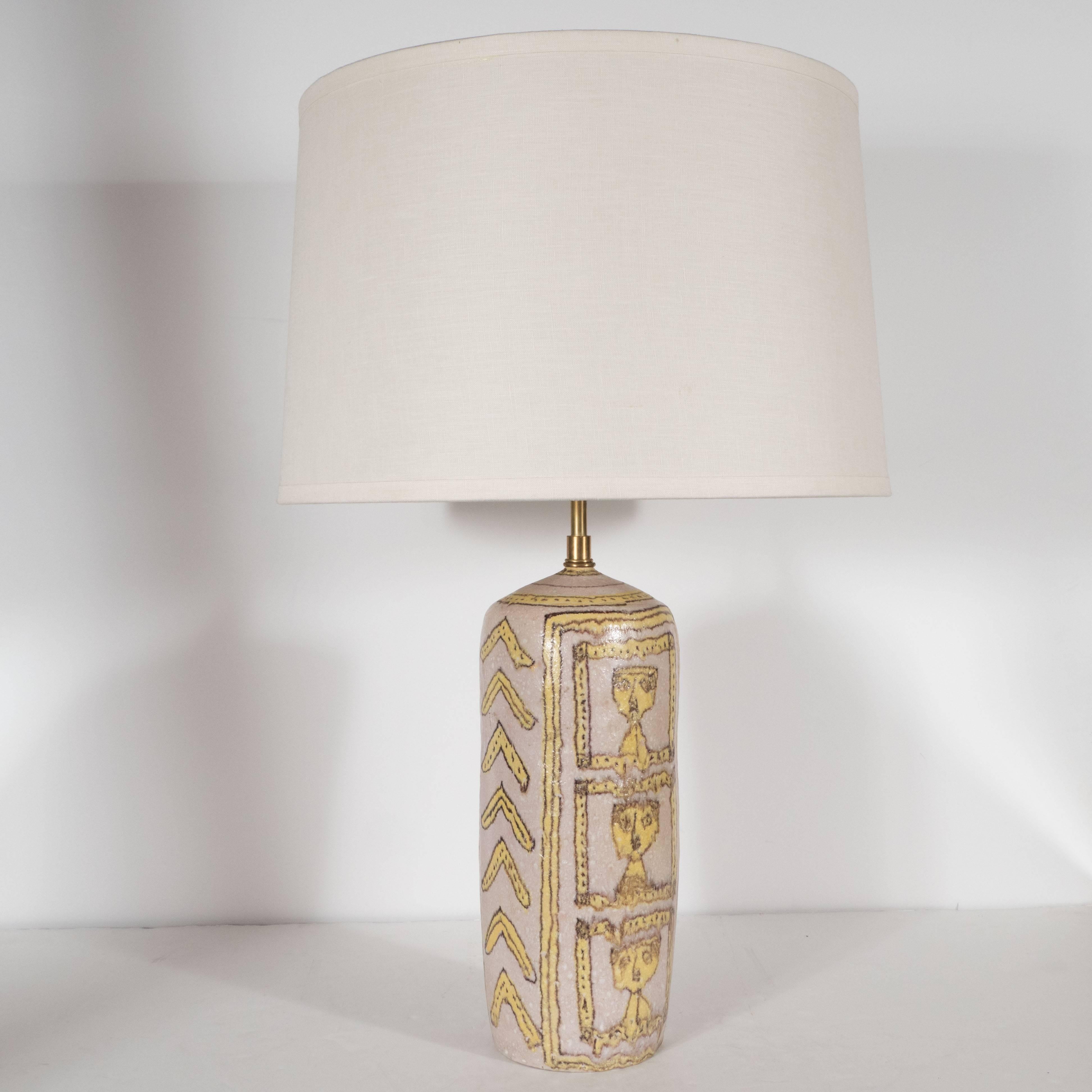 The hugely influential Italian artist Guido Gambone designed this stylish table lamp, circa 1950, which was then sculpted, by hand, out of ceramic in Italy. Hand-painted in hues of lemon and chocolate brown against a thulian pink background, this