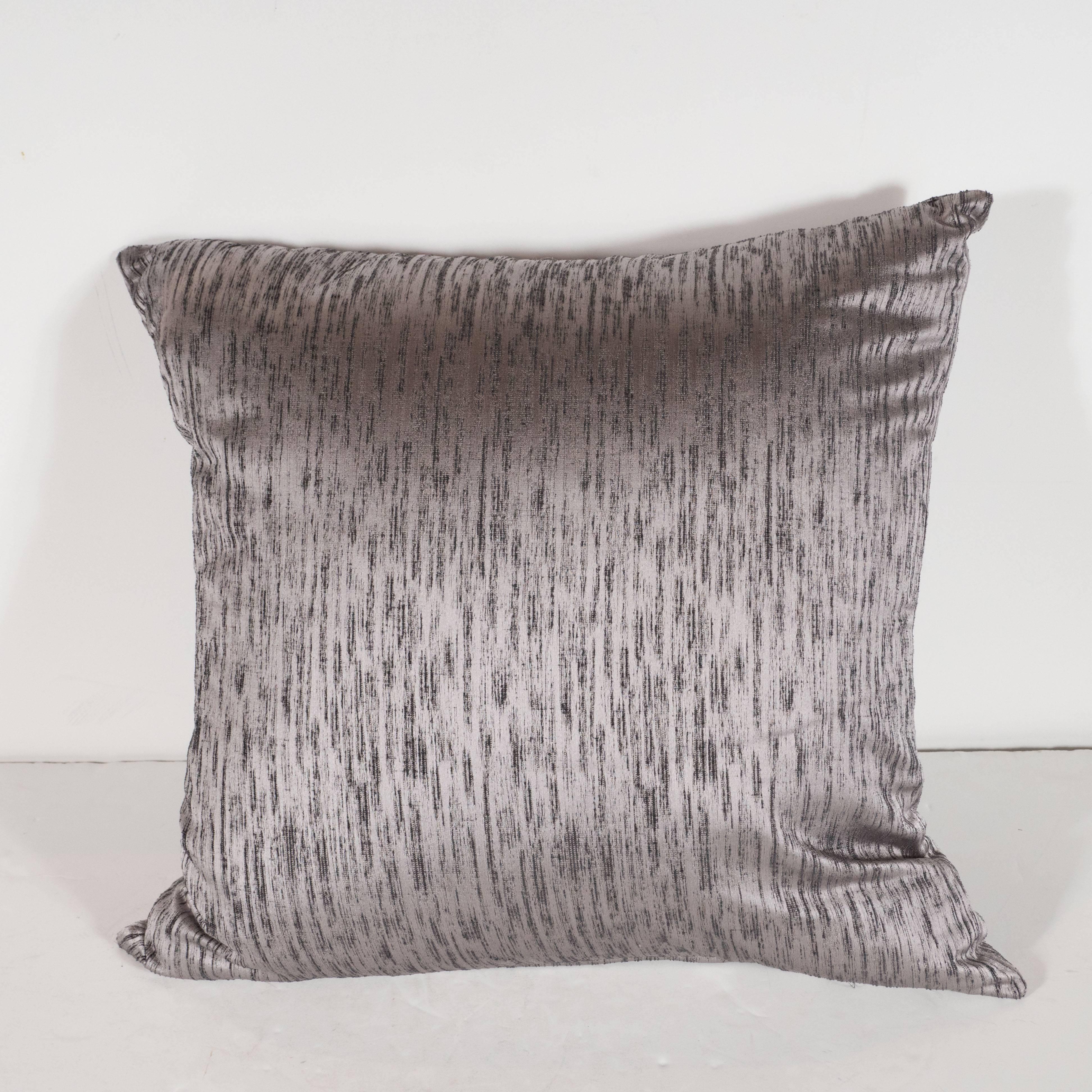 This gorgeous pair of modernist pillows are hand finished in a beautiful silvered lavender silk fabric replete with a wealth of striated organic texture. They would be a stunning addition to any style of interior from classic Mid-Century Modern to