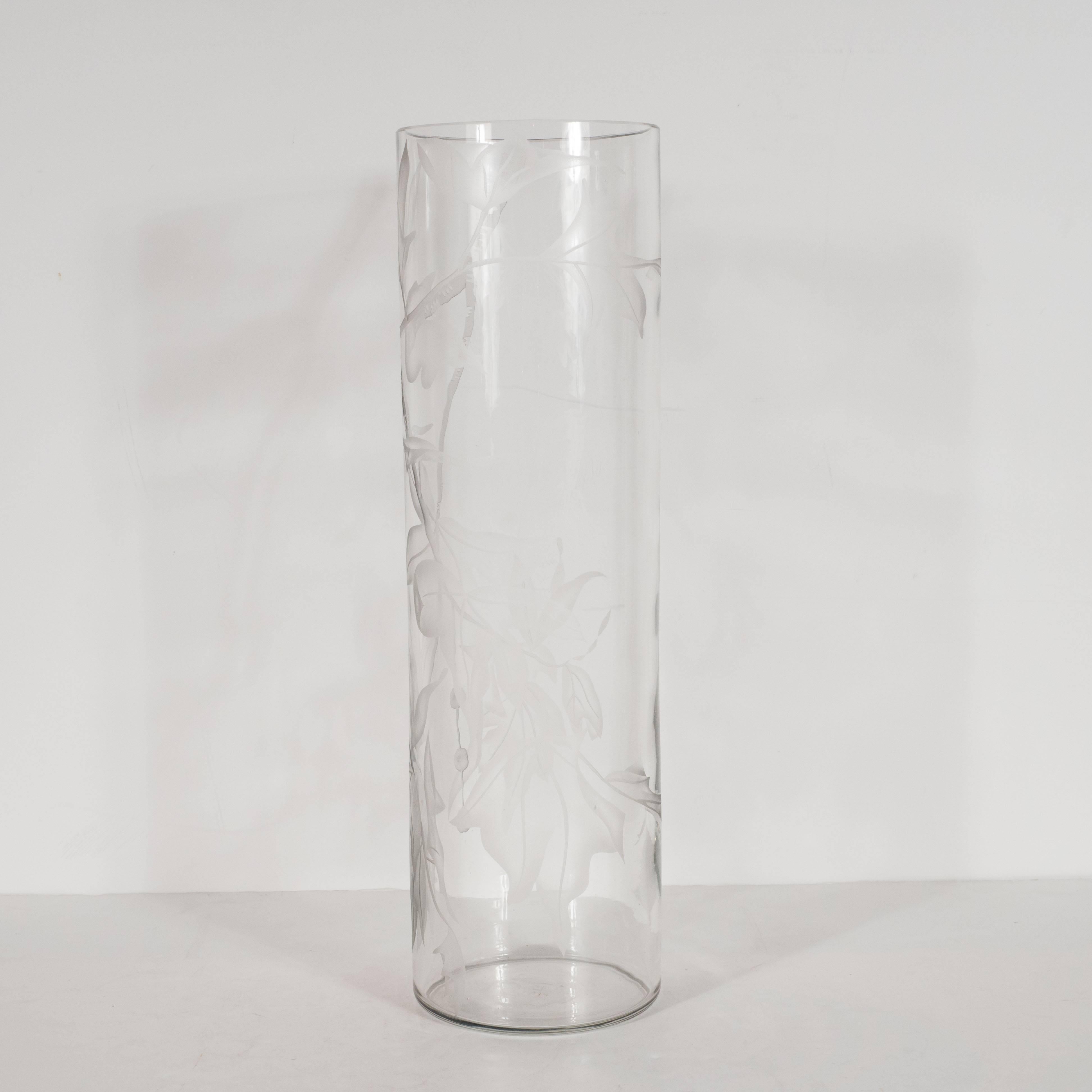 This sophisticated vase was created by Dorothy Thorpe, the acclaimed midcentury glassware designer, in the 1950s. Its understated elegance- consisting of an austere cylindrical form and acid etched maple leaf motif- helps to explain her renown.