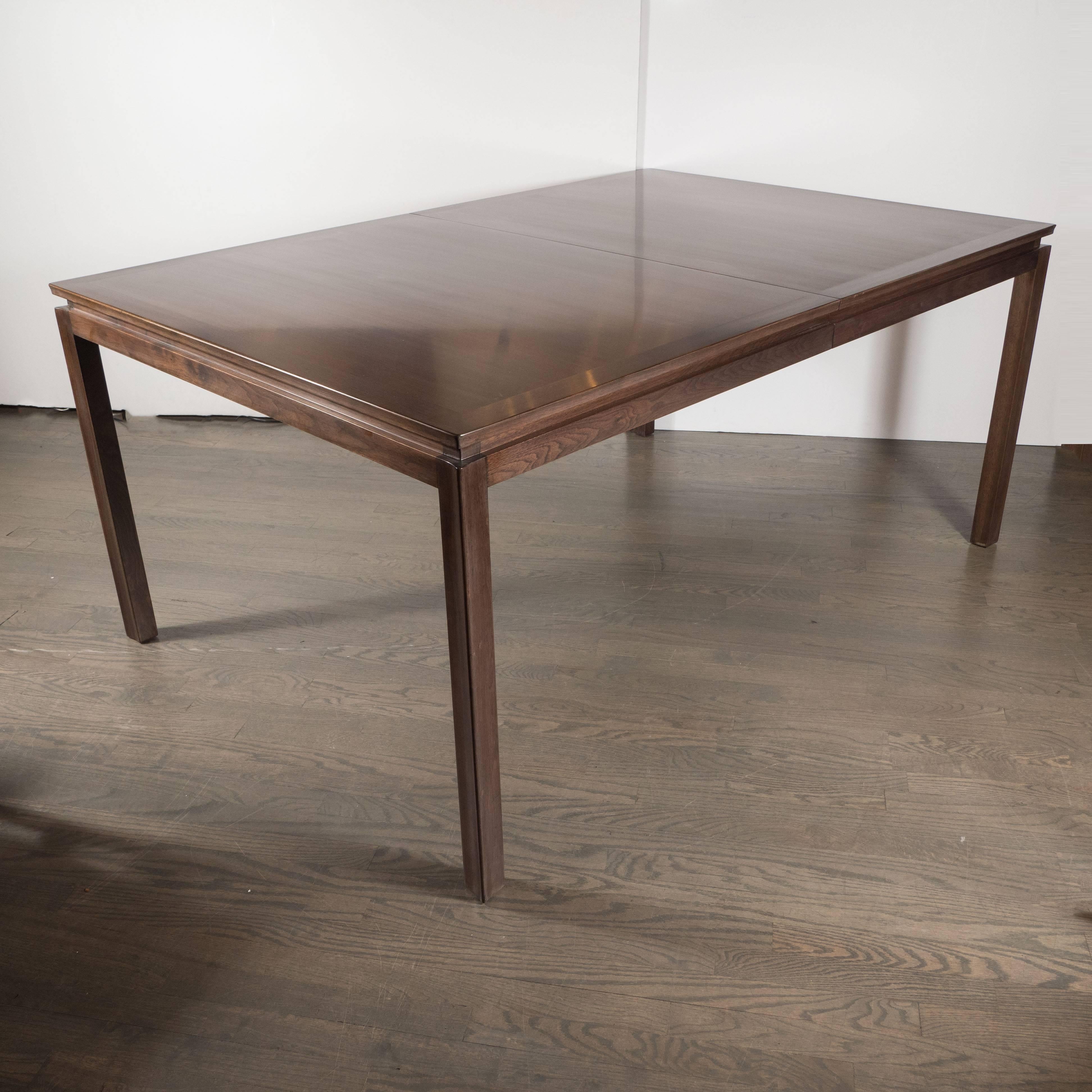 This handsome dining table was realized by Edward Wormley for Dunbar, where Wormley served as long-time director of design. Celebrated for his modern interpretations on Classic designs, this table embodies the timeless aesthetic for which he is