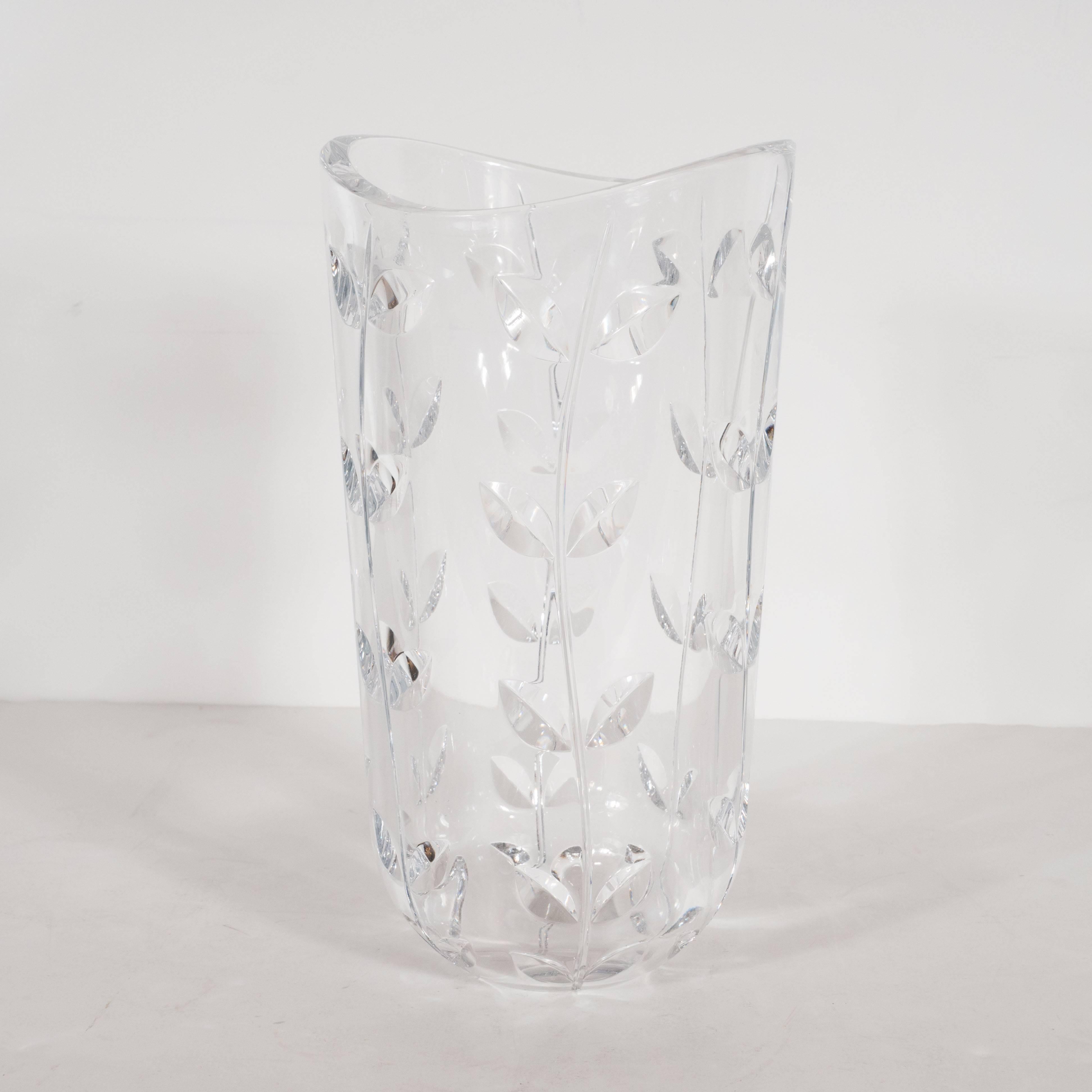 This gorgeous crystal vase was realized by Tiffany & Co. America's premiere luxury goods purveyor, specializing in sterling silver and crystal- since 1837. It features an organically sculpted top with undulating curves and foliate patterns