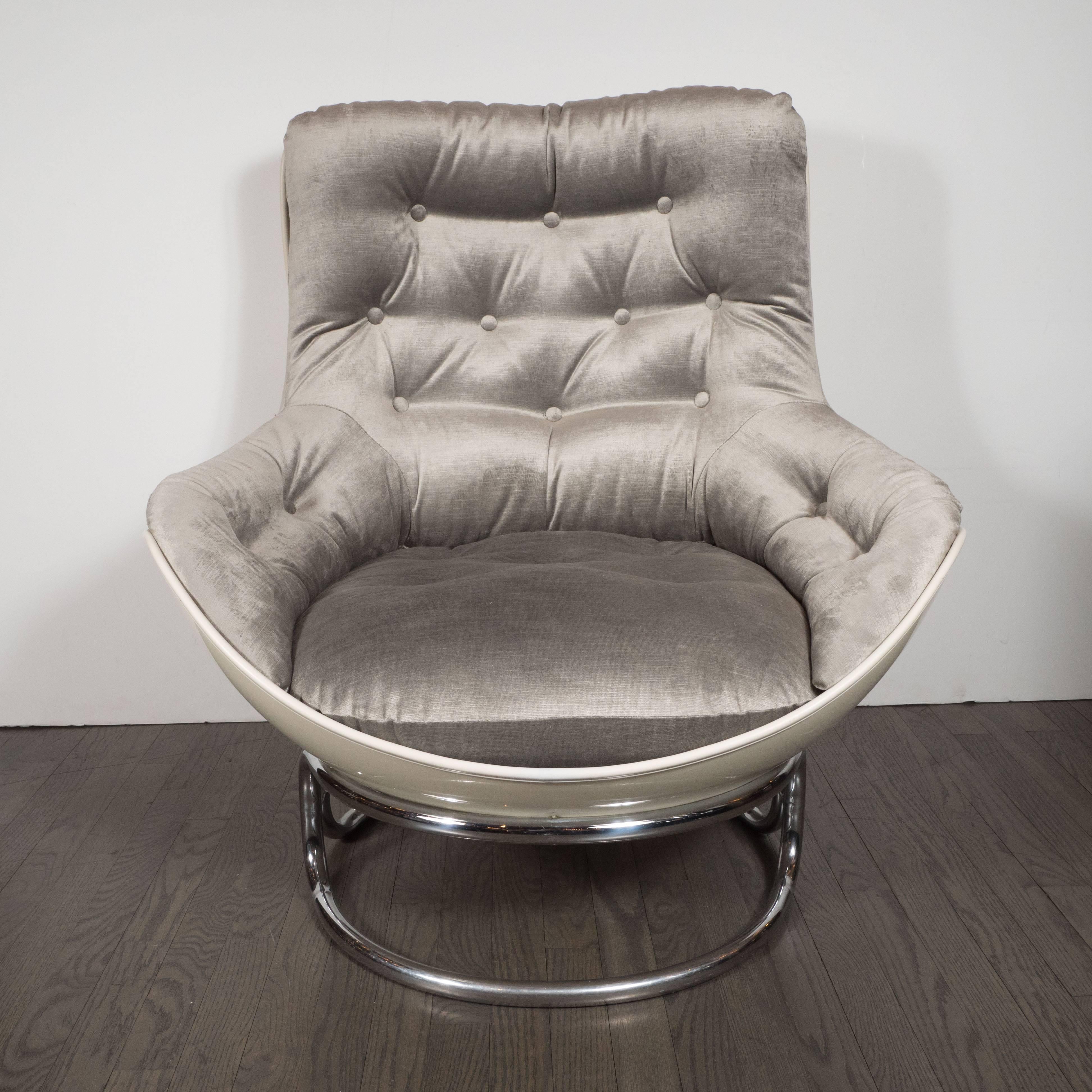 This sophisticated and dynamic pair of lounge chairs was produced by the esteemed French maker Airborne, circa 1970. They feature button back upholstery on every facet of the chair surrounded by lustrous white fiberglass surrounds with piping in the