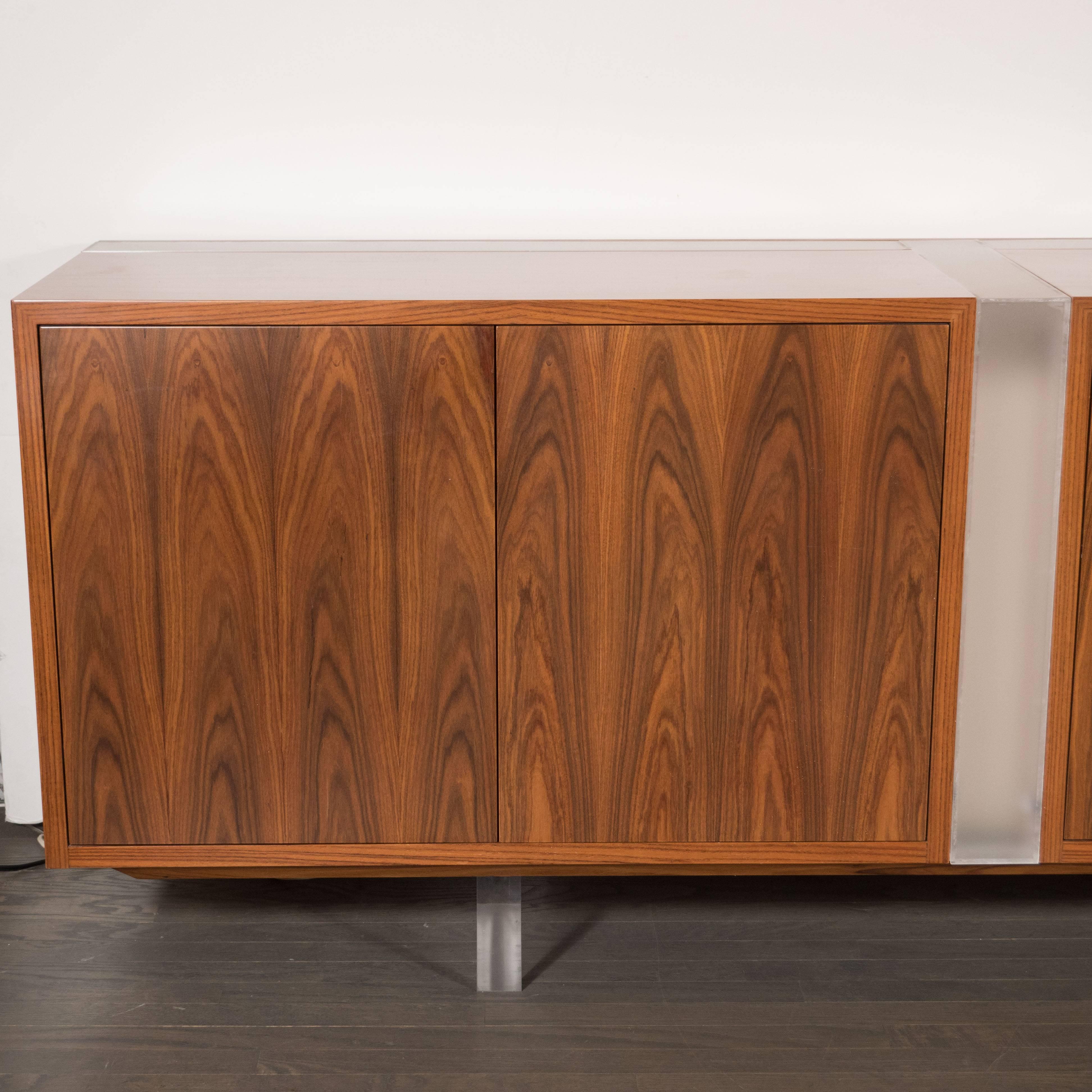 This rare and iconic sideboard or cabinet was designed by Vladimir Kagan- one of the most celebrated and influential designers of the 20th century, circa 1960. This piece executed in Santos rosewood- that exhibits a particularly stunning grain- and
