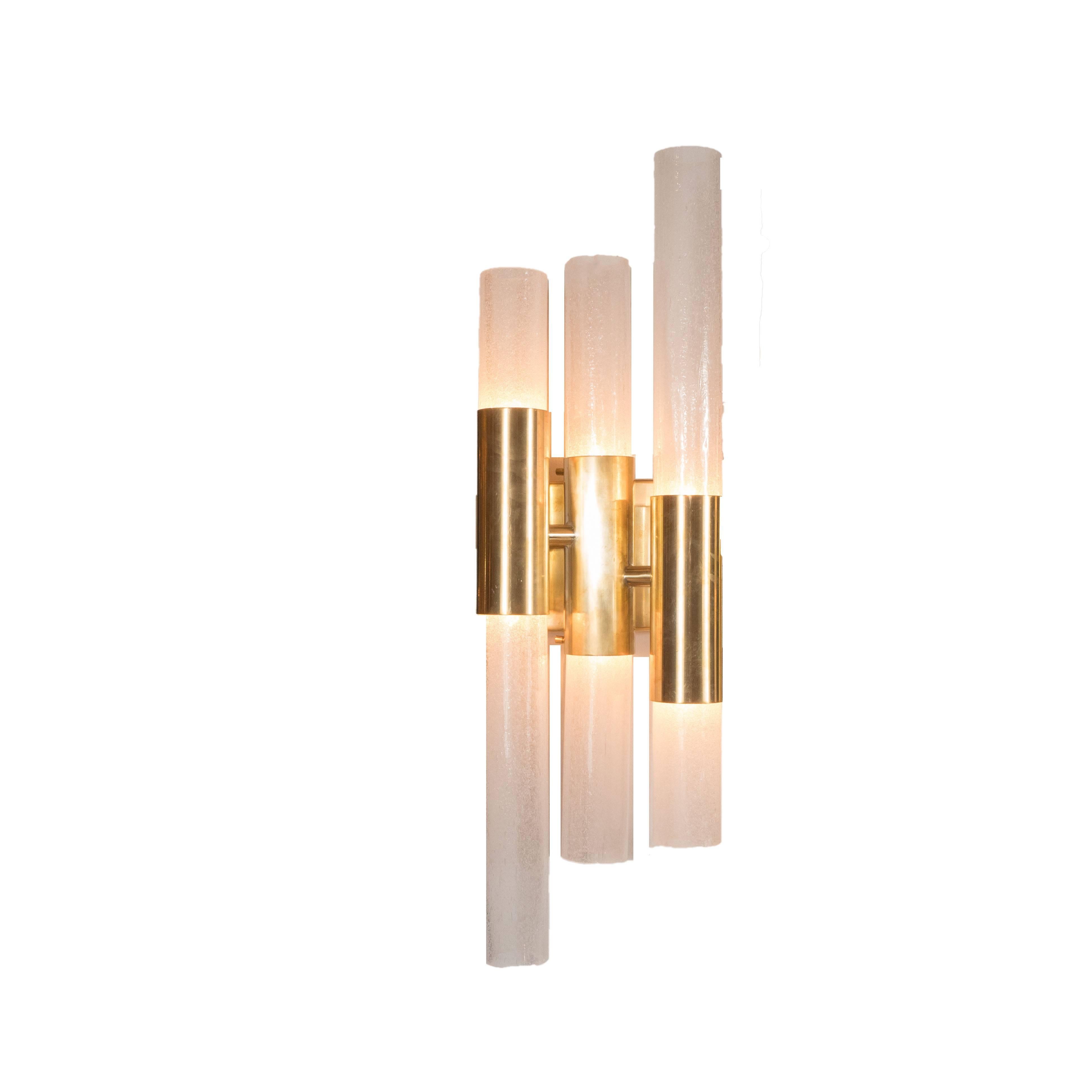 This stunning pair of modernist Pulegoso sconces were handblown in Murano, Italy- the islands off the coast of Venice renowned for centuries for their superlative glass production. They feature a staggered form created by tubular shades of differing