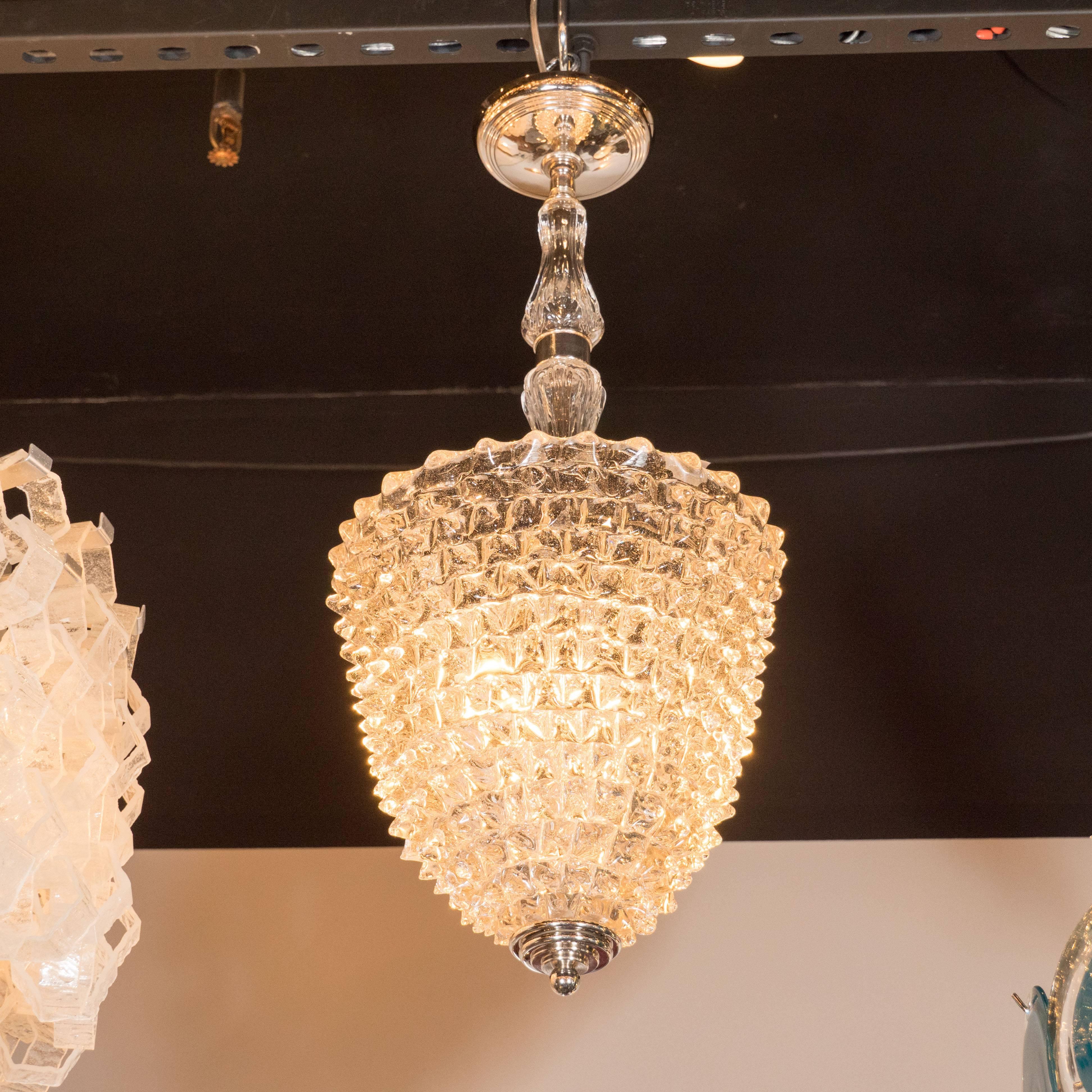 This gorgeous vintage pendant was realized by the illustrious 20th century, Italian lighting atelier, Barovier e Toso, circa 1945. It offers a conical form replete with an abundance of small protrusions creating a unique texture that testifies to