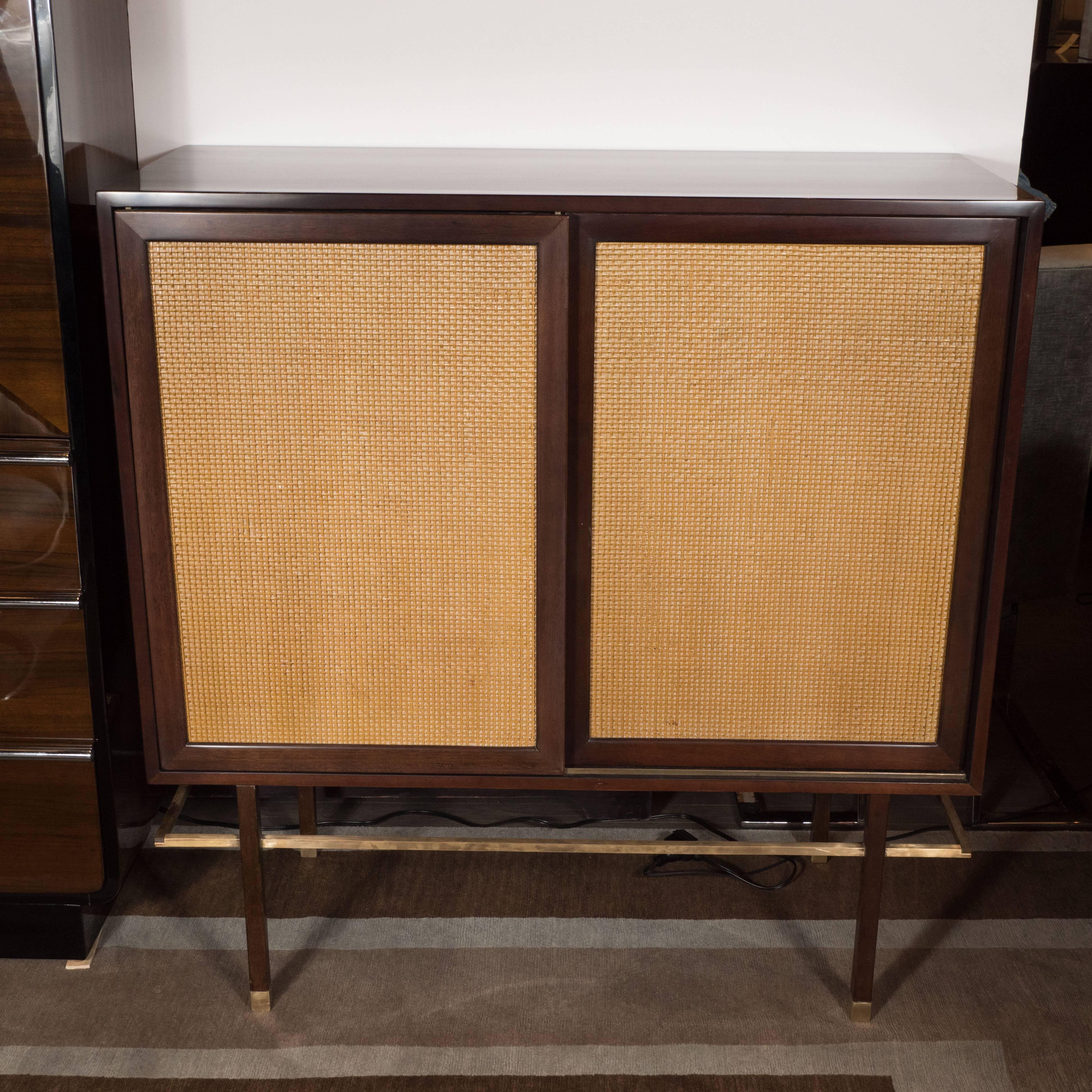 This sophisticated cabinet was designed by Harvey Probber, circa 1960 and handmade in Fall River, Massachusetts. Probber was celebrated with his austere and elegant designs, creating furniture with the belief that 