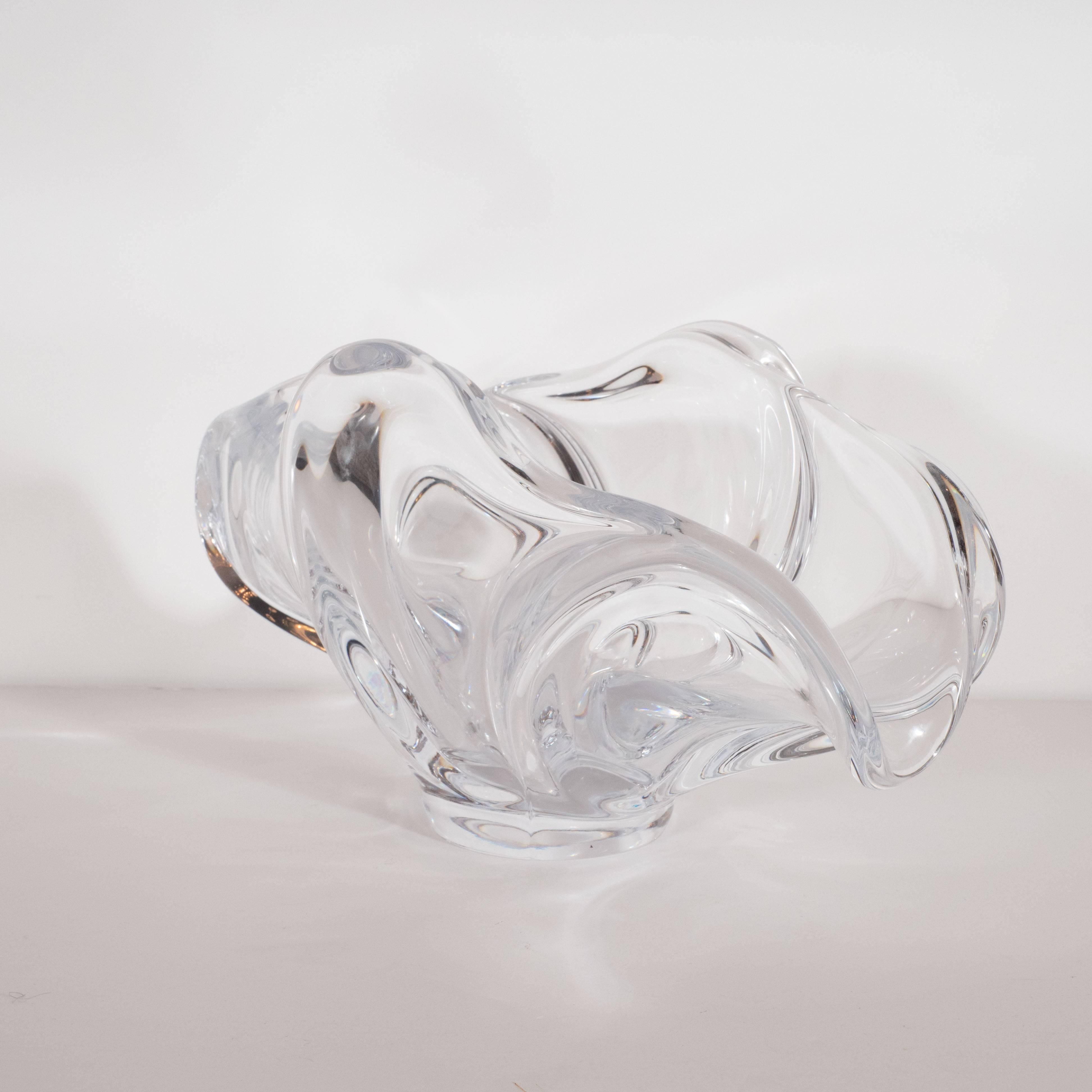 This dramatic and sculptural bowl was realized by the fabled French glass making studio- Art Vannes- circa 1950. It features raised sides and open ends with curvilinear forms throughout lending it the appearance of flowing silk fabric. With its