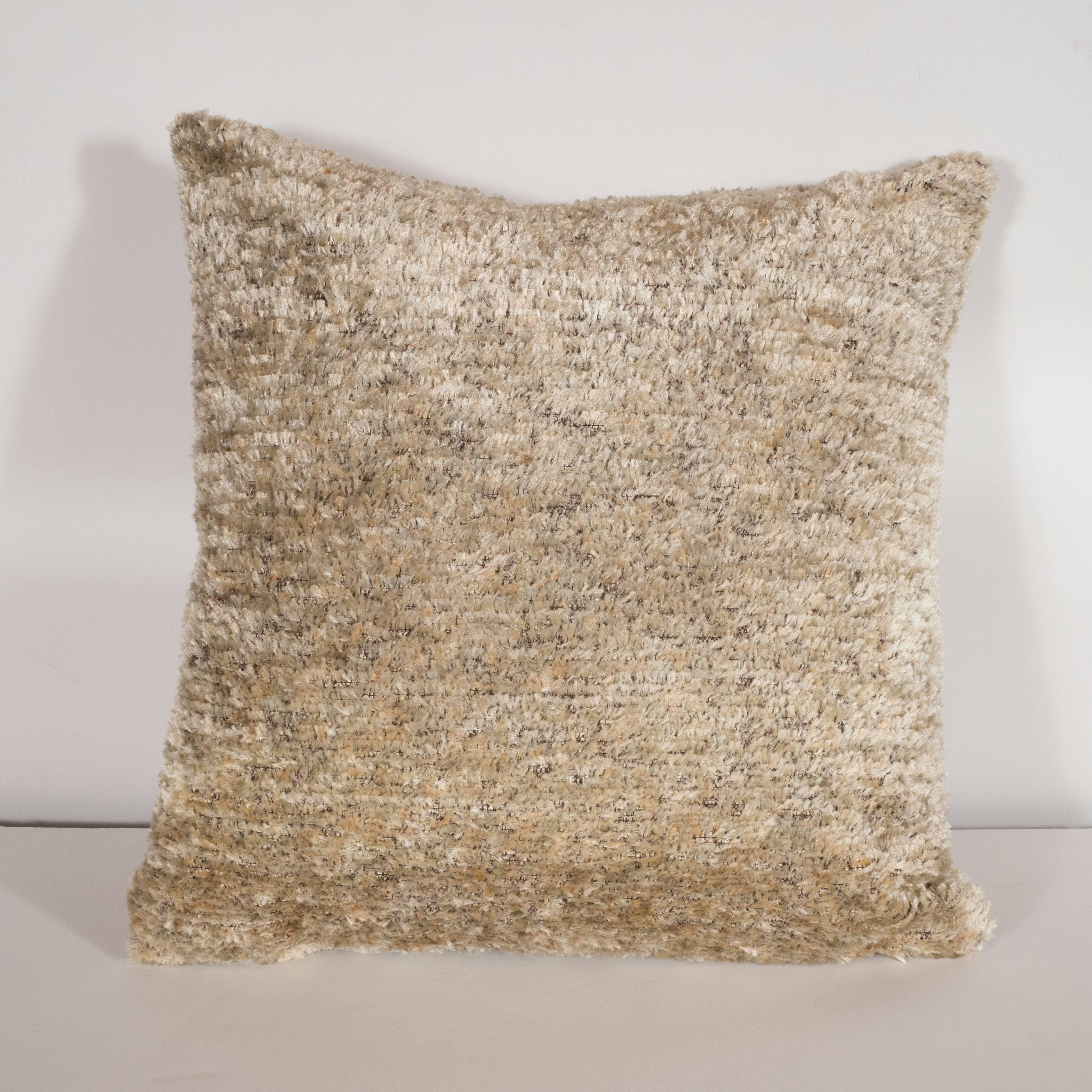 Custom designed champagne colored pillow with white Mongolian lambswool circlea this stunning and elegant modernist pillow was custom designed in the United States. It features a solid back composed of a silk/wool/synthetic blend in a champagne hue,