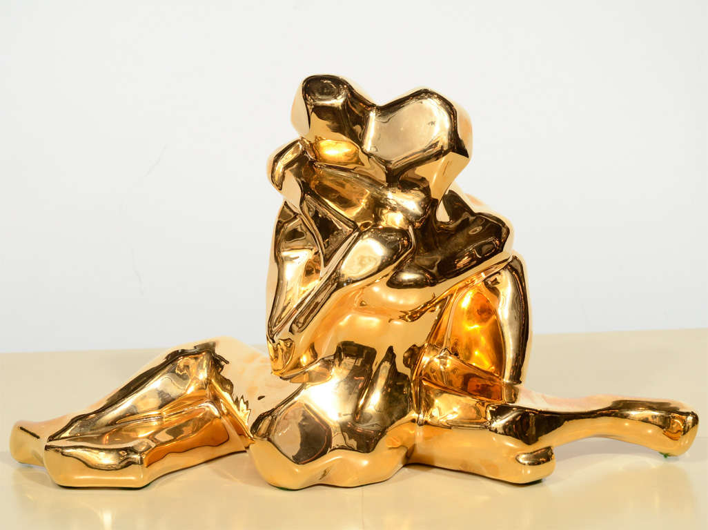 This dynamic and graphic 24-karatt gold plated ceramic sculpture was realized by Jaru of California, circa 1970. Entitled 
