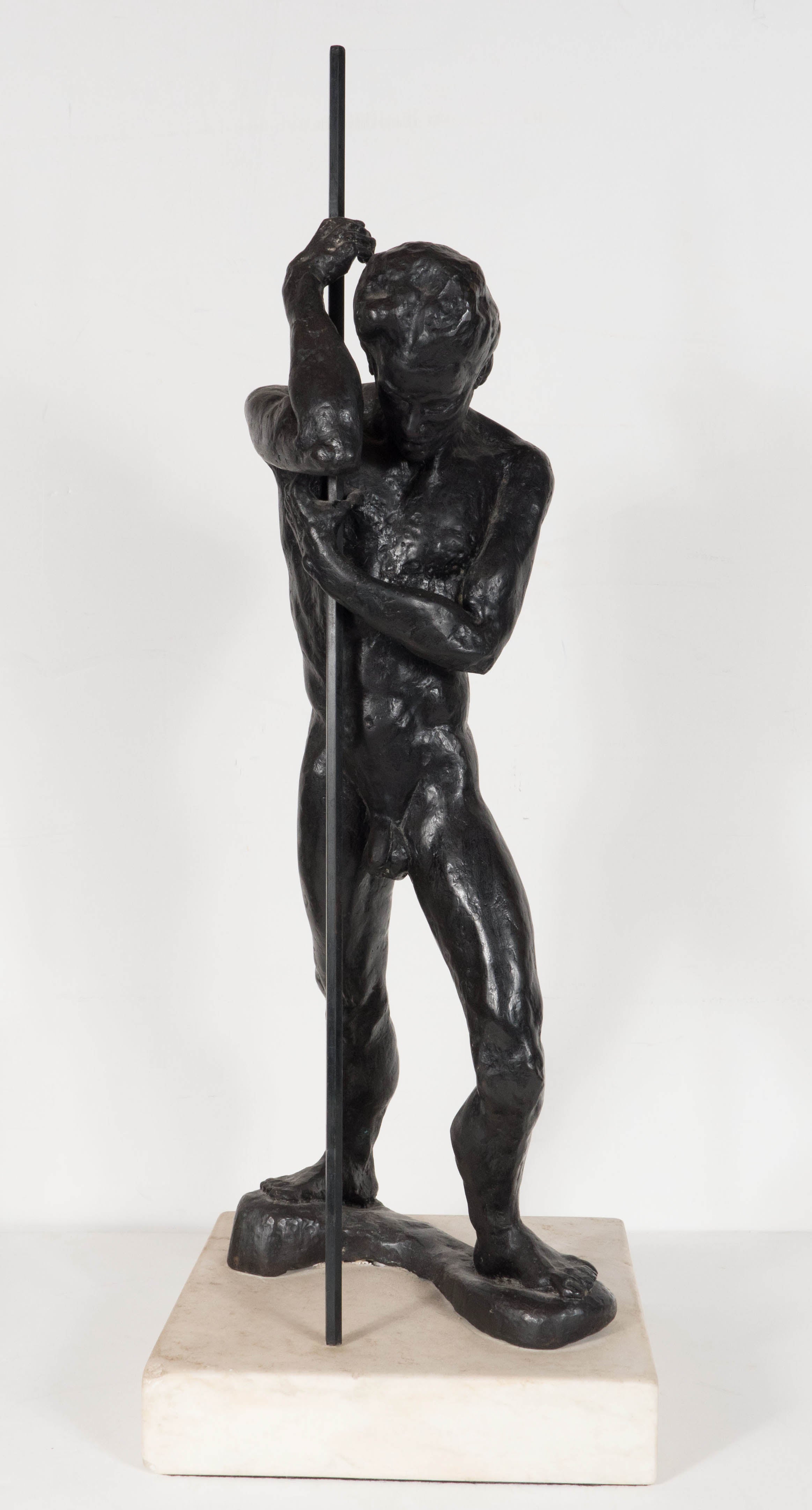 Bronze Man With a Staff by Dori Gallione on a White Marble Base