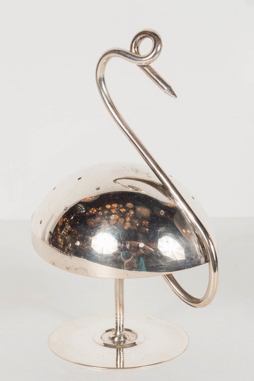 This sophisticated Art Deco silver plate cocktail holder by Napier features  an artistic simplification of the Flamingo form, the body provides small holes into which picks adorned with olives and other condiments can be displayed to mimic that of