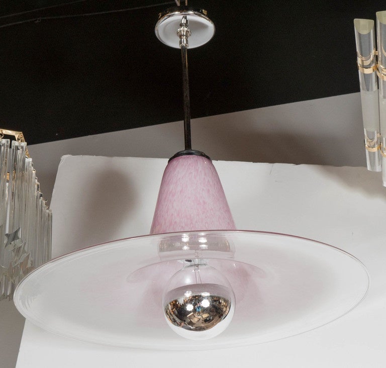 This gorgeous Mid-Century Modernist saturn chandelier in the manner of Carlo Nason features a Minimalist splayed cone design in orchid with an ombre effect and white colored Murano glass. The bulb nestles into the void in the underside of the glass