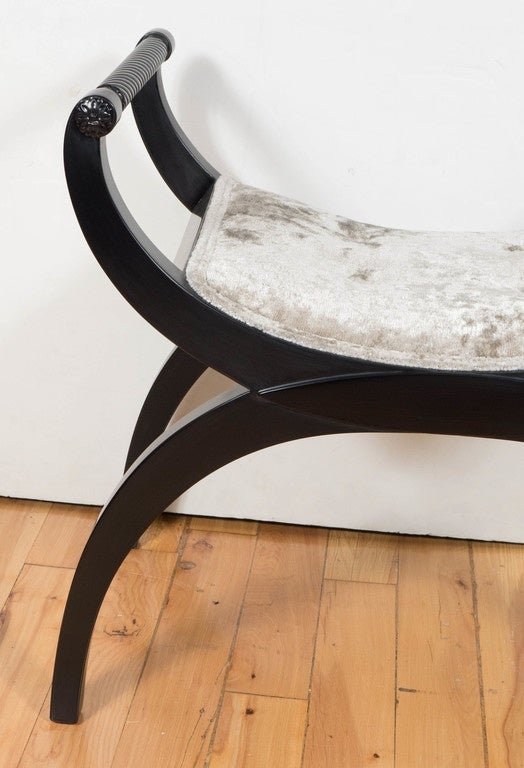This Mid-Century Modernist stool features a U-form shape in black lacquer with a luscious oyster gauffraged velvet upholstery. The classical Modernist form of this stool mixes beautifully with any decor. It has been mint restored.