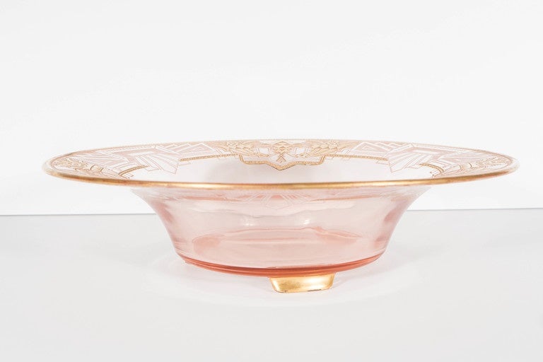 This pale cognac glass bowl features a stylized etched Art Deco cubist geometric design with accented details in 24k gold. This is a very sophisticated accent bowl that would add a touch of glamour to any room.

France, Circa 1930

Dimensions:
3