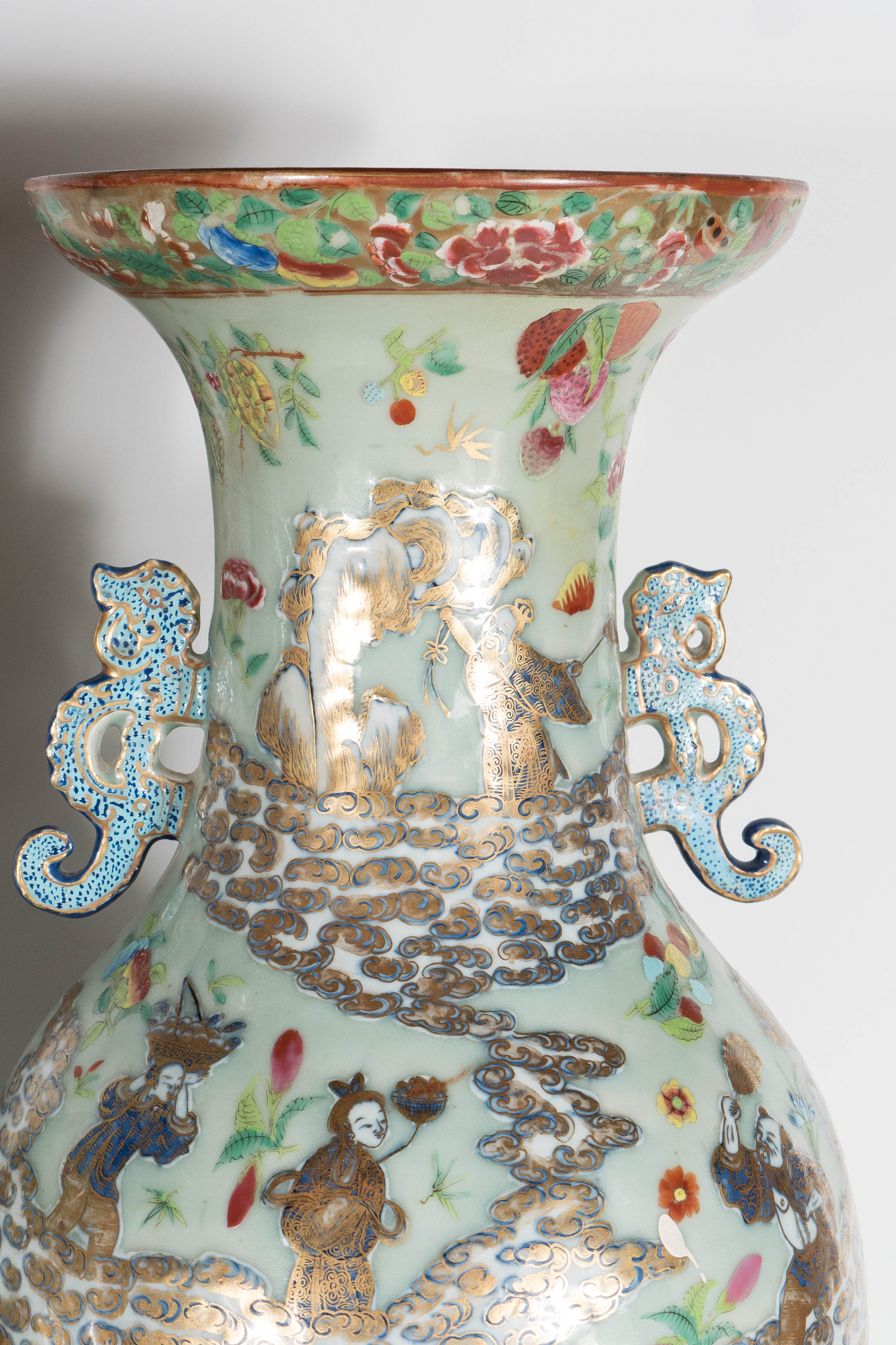 Pair of exquisite celadon Chinese famille rose floor vases, having baluster shaped body. Two chi-long dragon ears flanked to the neck. The bodies are richly decorated in famille rose design with vivid plums, flower blossoms, foliage, exotic birds