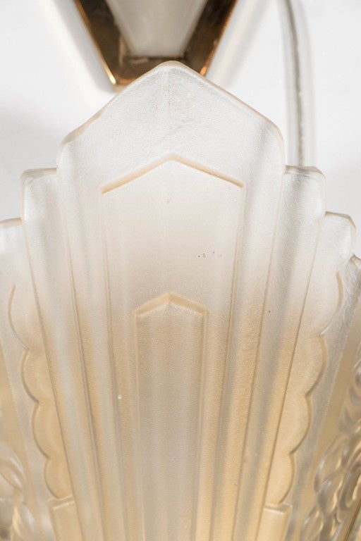 Set of Four Art Deco Relief Glass and Brass Sconces by Degué In Excellent Condition In New York, NY