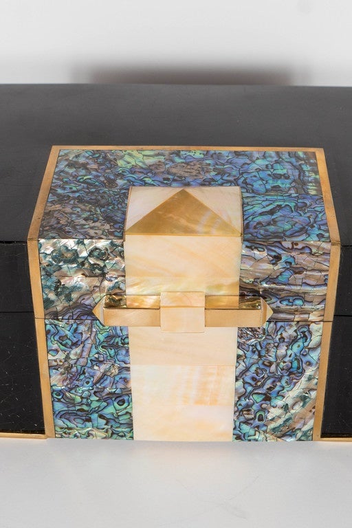 Exquisite Blacktab shell box with Kabibi and Tahiti Shell inlays with Brass trim accents and fittings.  This stunning Blacktab Shell box is in a geometric trapezoidal shape with angled-cut corners and features an overlay of Tahiti Shell that