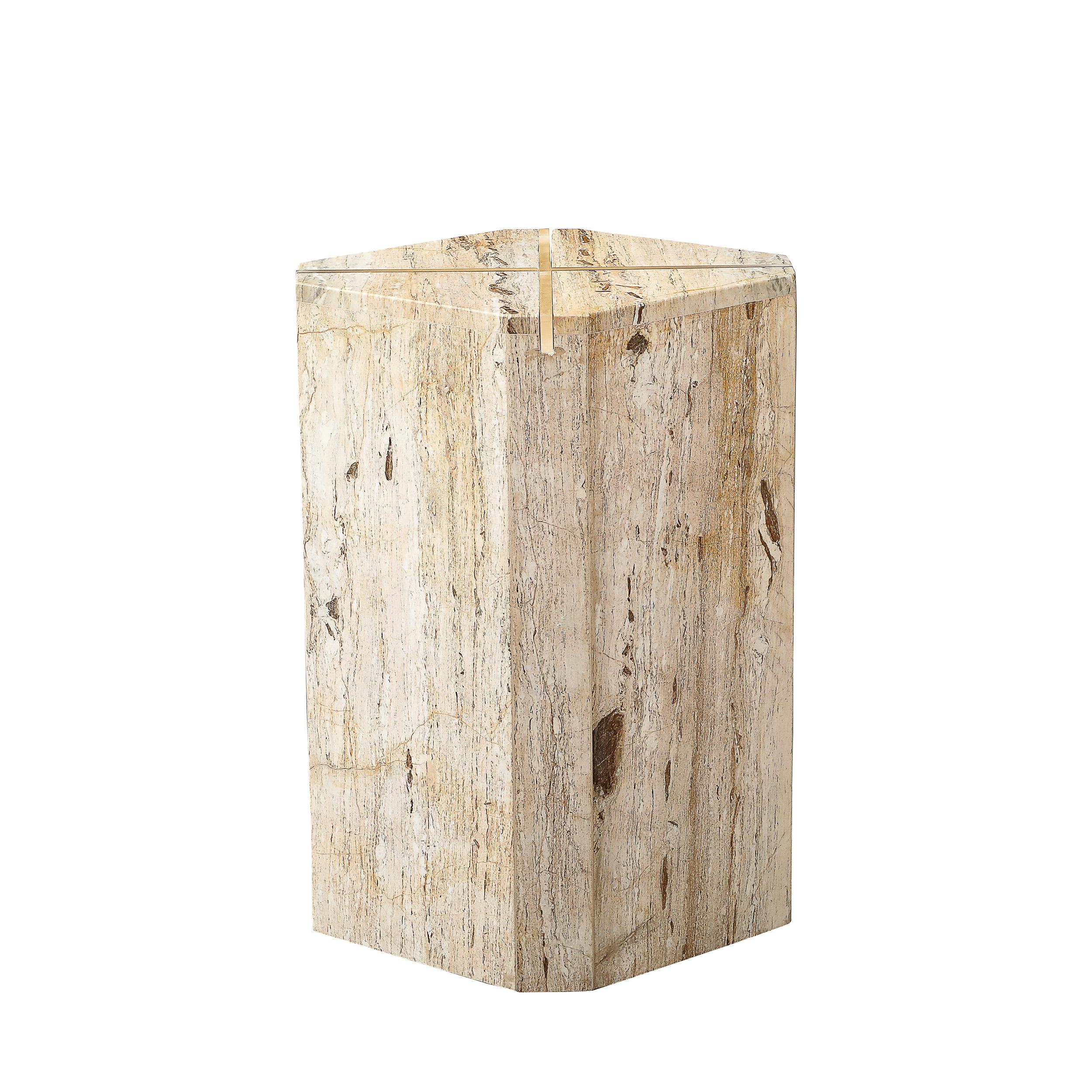 This refined pedestal is composed of an octagonally cut and perfectly polished slab of travertine marble with a cross-shaped illuminating insert in its center. The austere form highlights the inherent beauty of the marble- replete with hues of