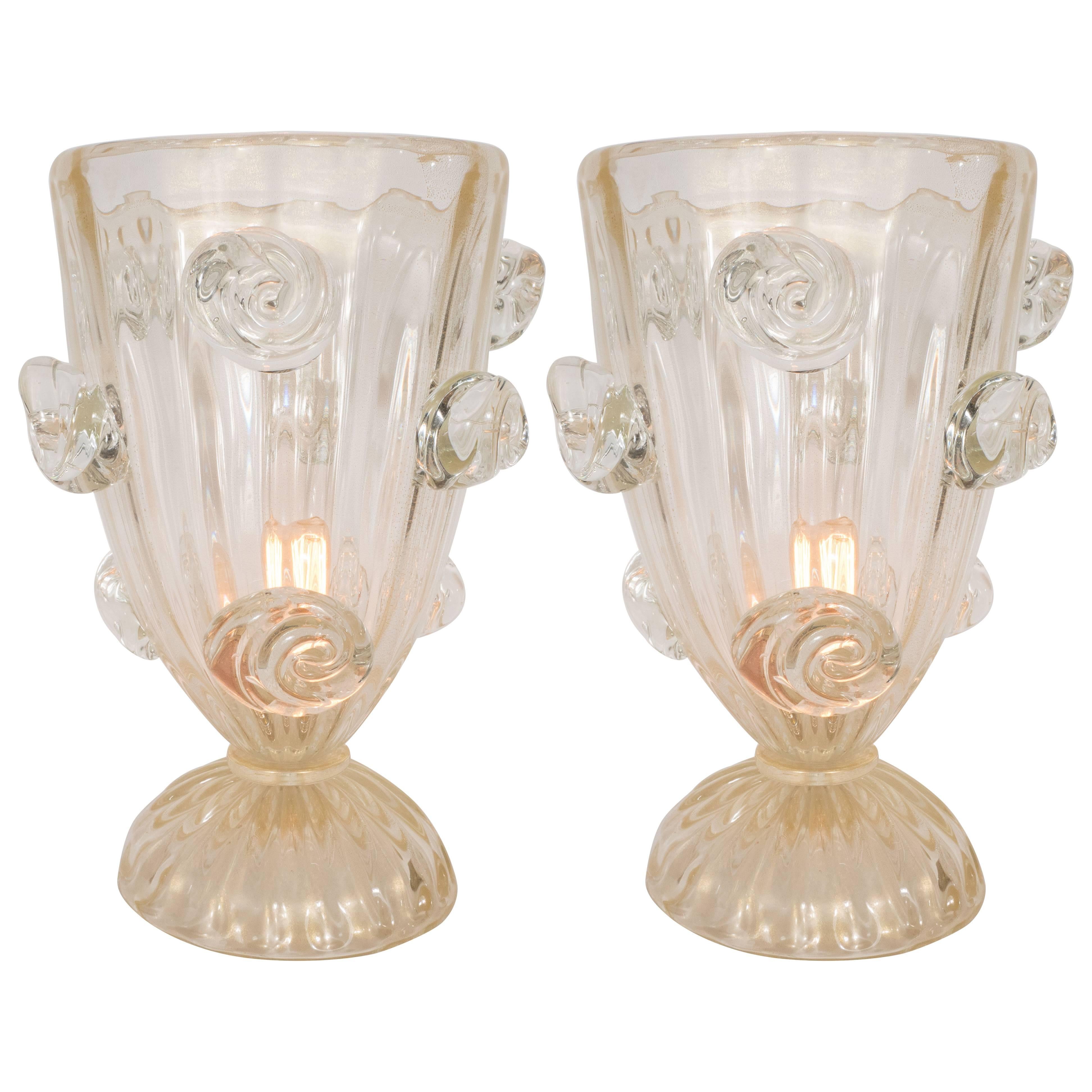 Exquisite pair of Art Deco Murano Venetian handblown glass up-lights featuring 24-karat yellow-gold flecks throughout in a fluted urn shape design and adorned with stylized handblown roses. Newly rewired.

Italian, circa 1945
Dimensions: