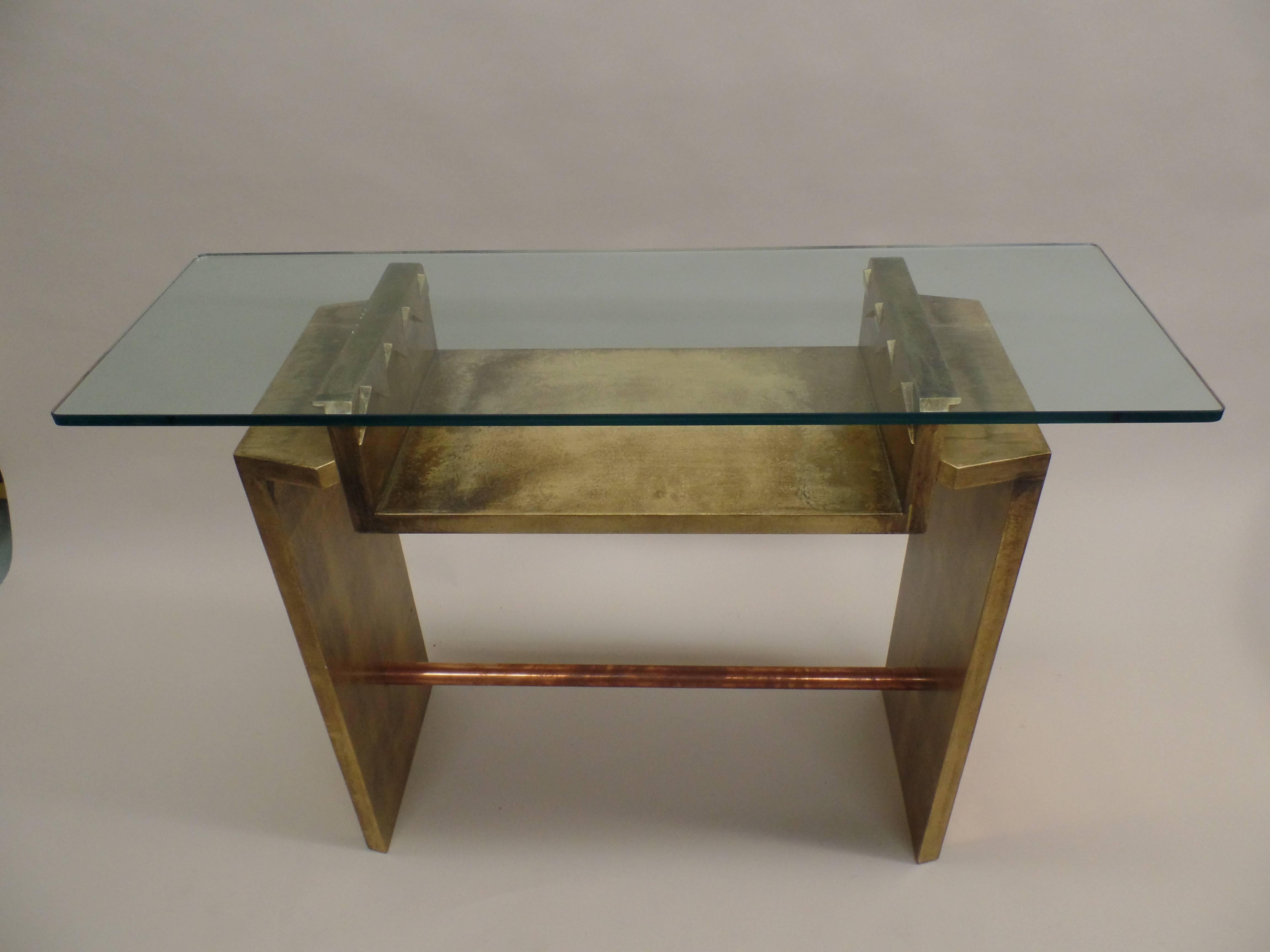 Pair of Italian consoles or sofa tables in giltwood with copper stretchers and copper side panels. Glass tops are 47.25 x 15.75 x 3/4