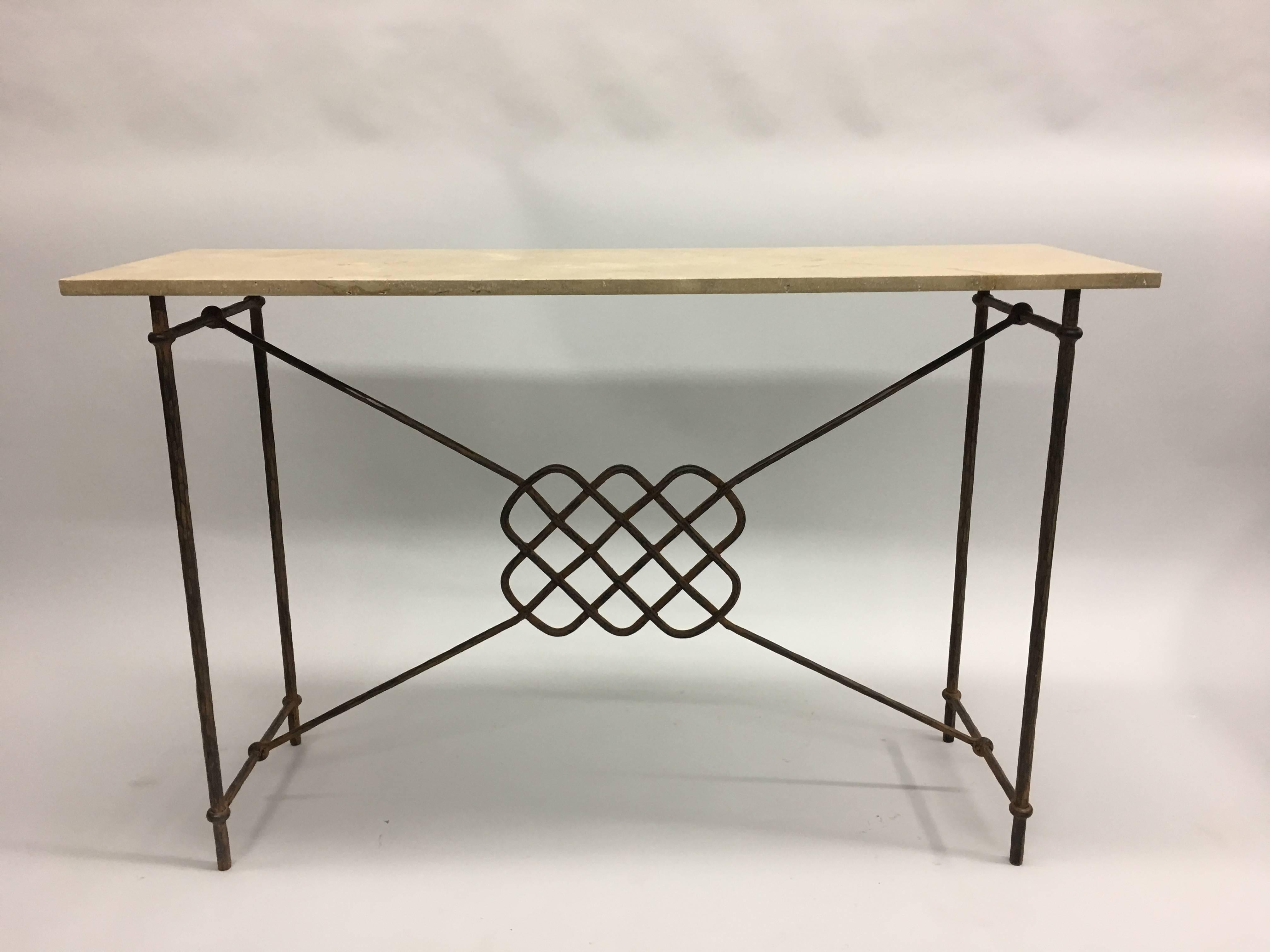 A deeply and sharply hand-hammered console in the style of Giovanni Banci in the modern neoclassical spirit. This Mid-Century piece features a dramatic hand-wrought ancient Celtic symbol in the centre panel. The top is composed of Italian