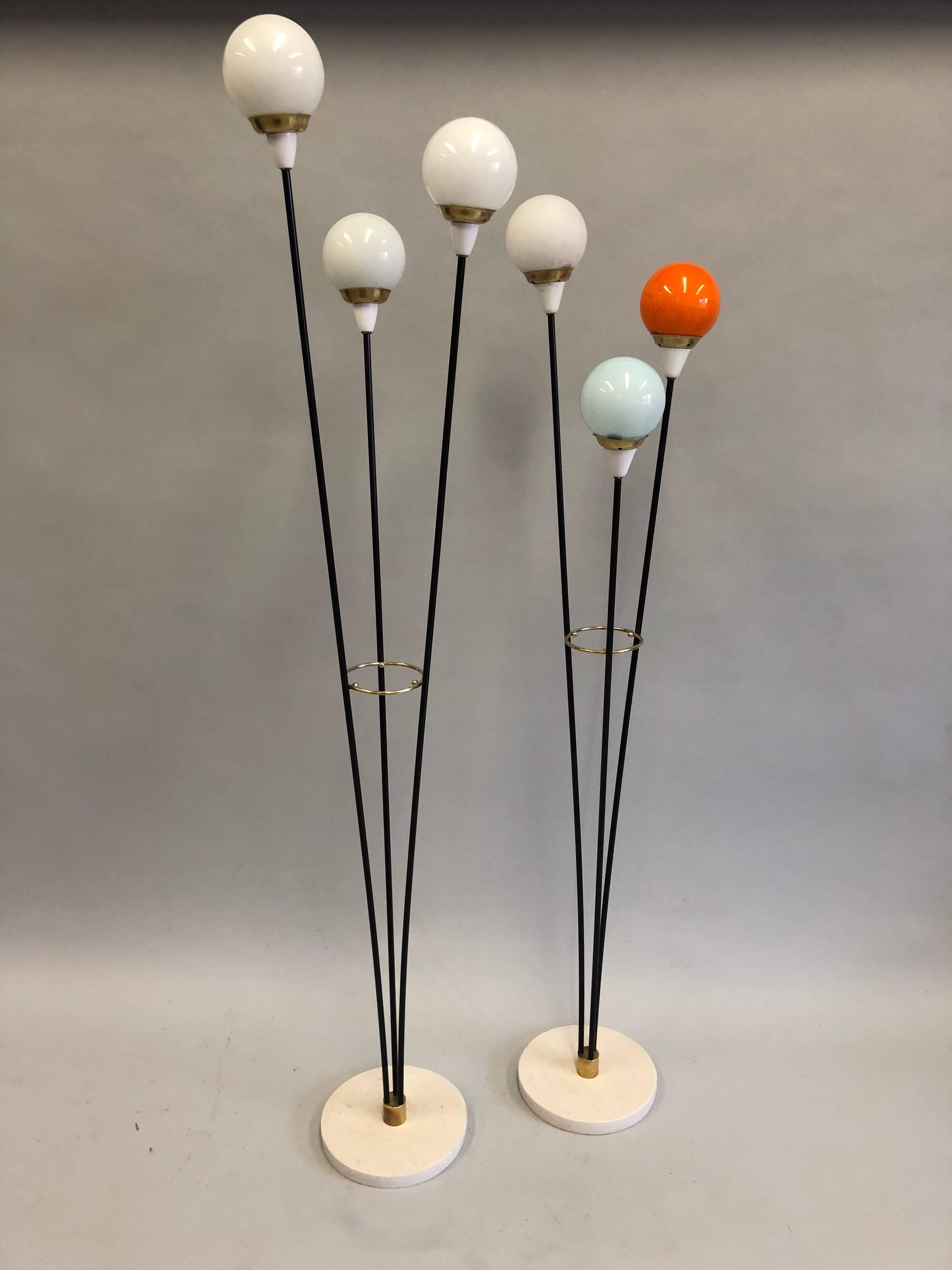 A Rare and Complimentary pair of Italian Mid-Century Modern floor lamps titled 