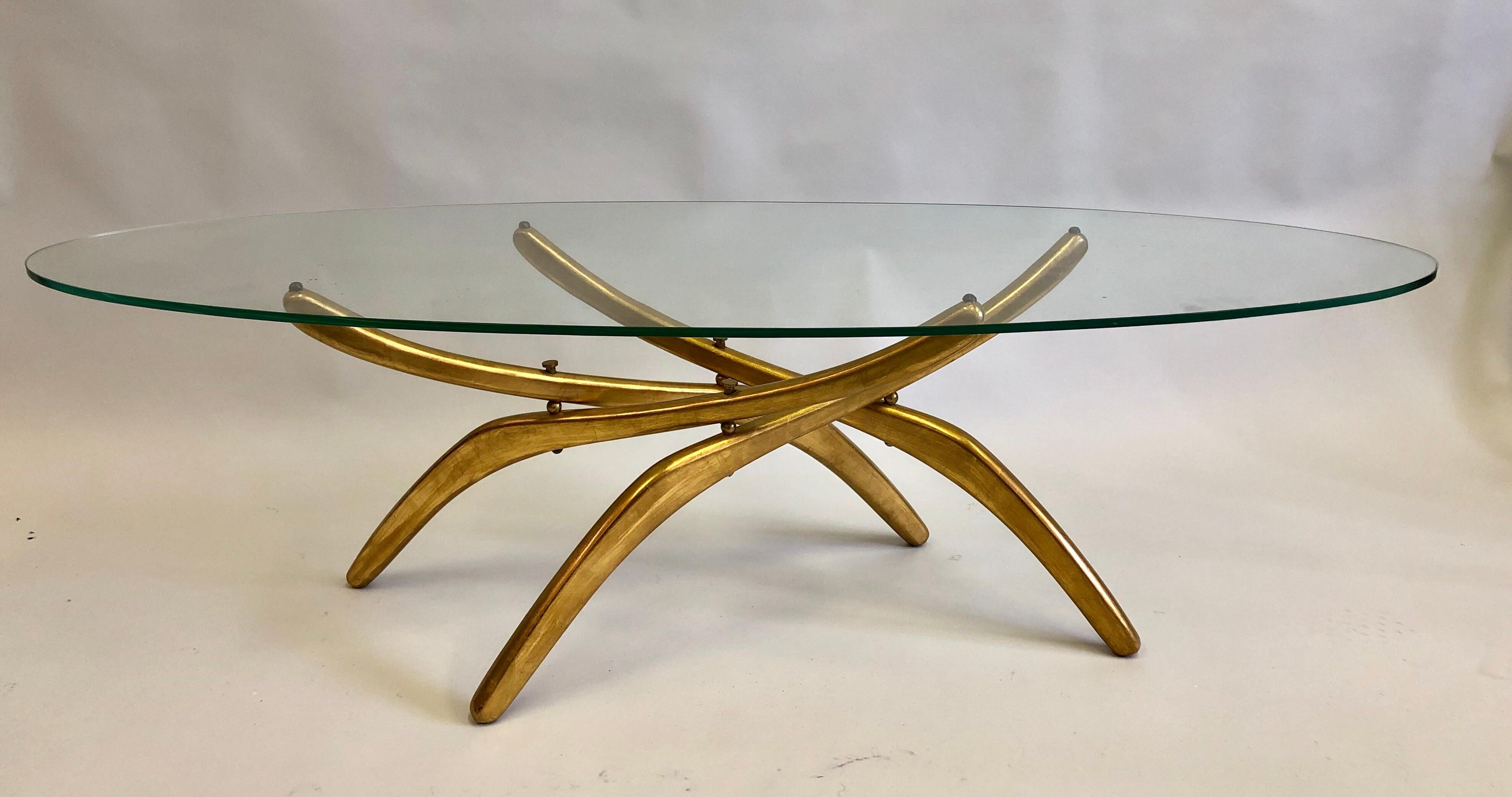 Important Italian Prototype Cocktail table Attributed to Carlo Mollino carved from wood and gilt to resemble metal. The table legs and spine resemble an insect such as an arachnid / spider. While maintaining a distinct modern look and feel. 

The