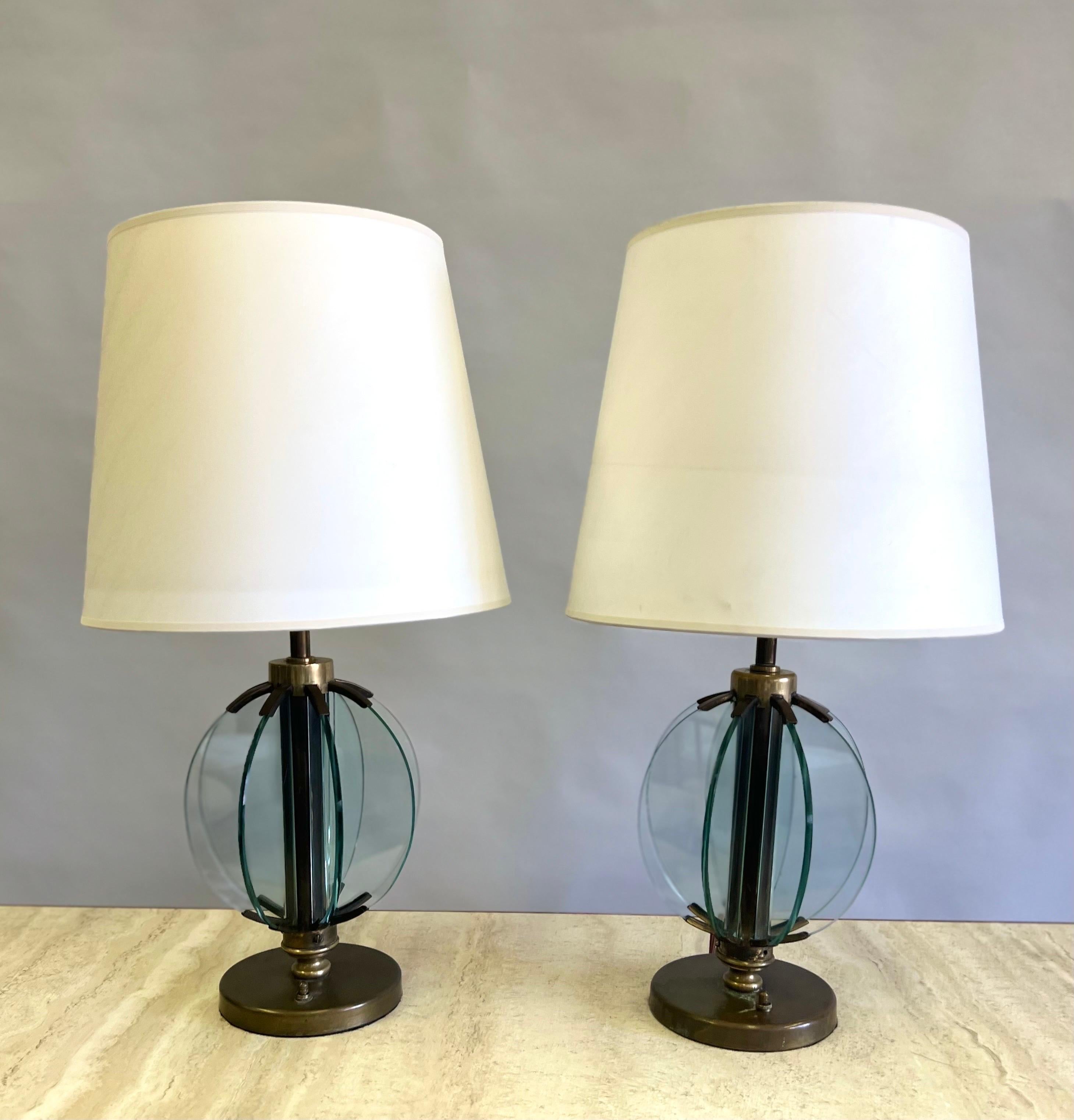 A rare and elegant pair of Italian Mid-Century Modern 'Astrolabe' table lamps by Pietro Chiesa for Fontana Arte reflecting the Italian Modern Neoclassical movement of the 1930-1940 period (Novecento). The pieces are masterpieces of design  composed