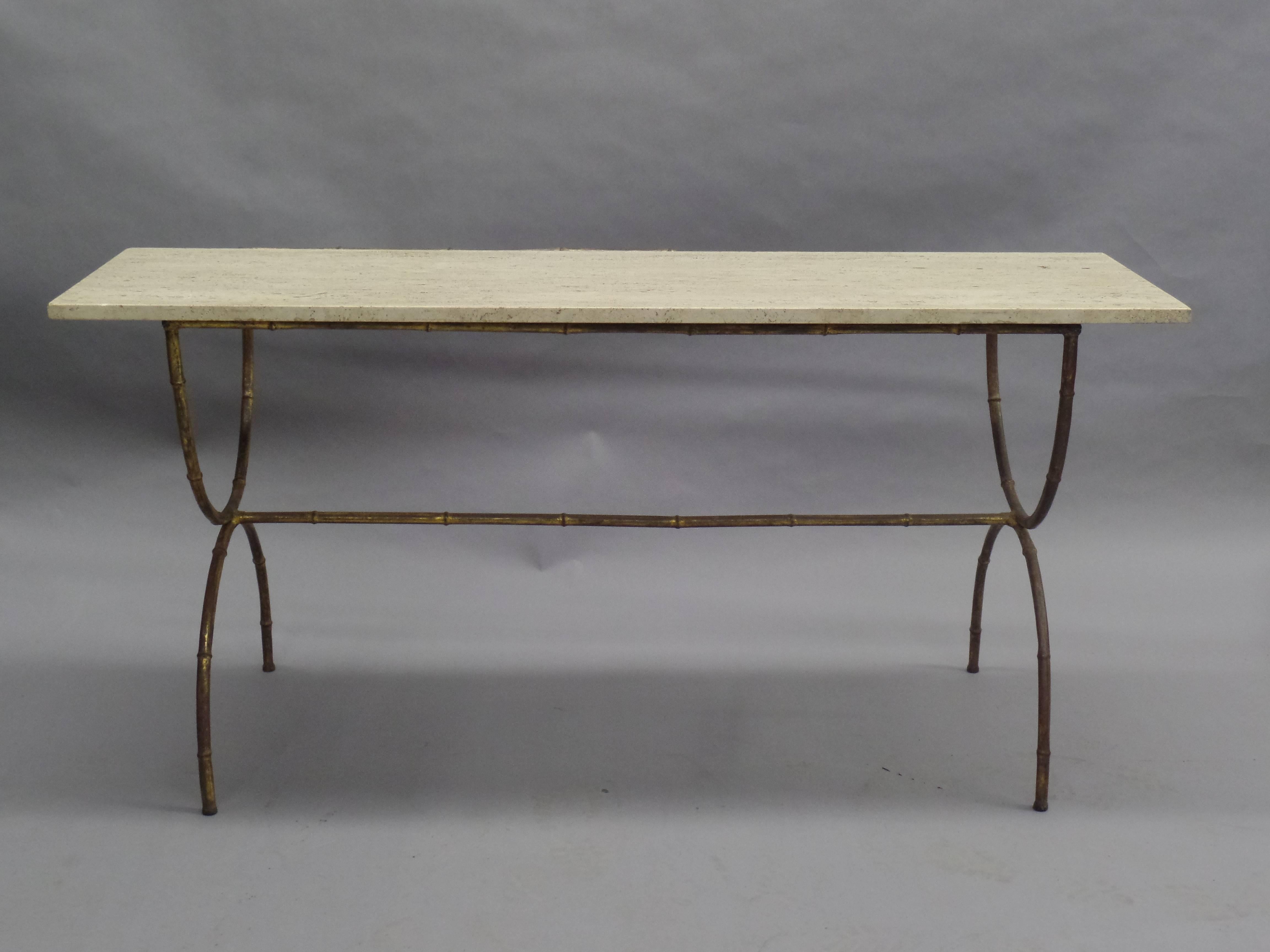 Elegant French Mid-Century Modern neoclassical sofa table, console or vanity in gilt faux bamboo by Maison Baguès. The table is designed in a modern neoclassical curile form with X-frame legs and a center stretcher uniting the legs. Top of calicatta
