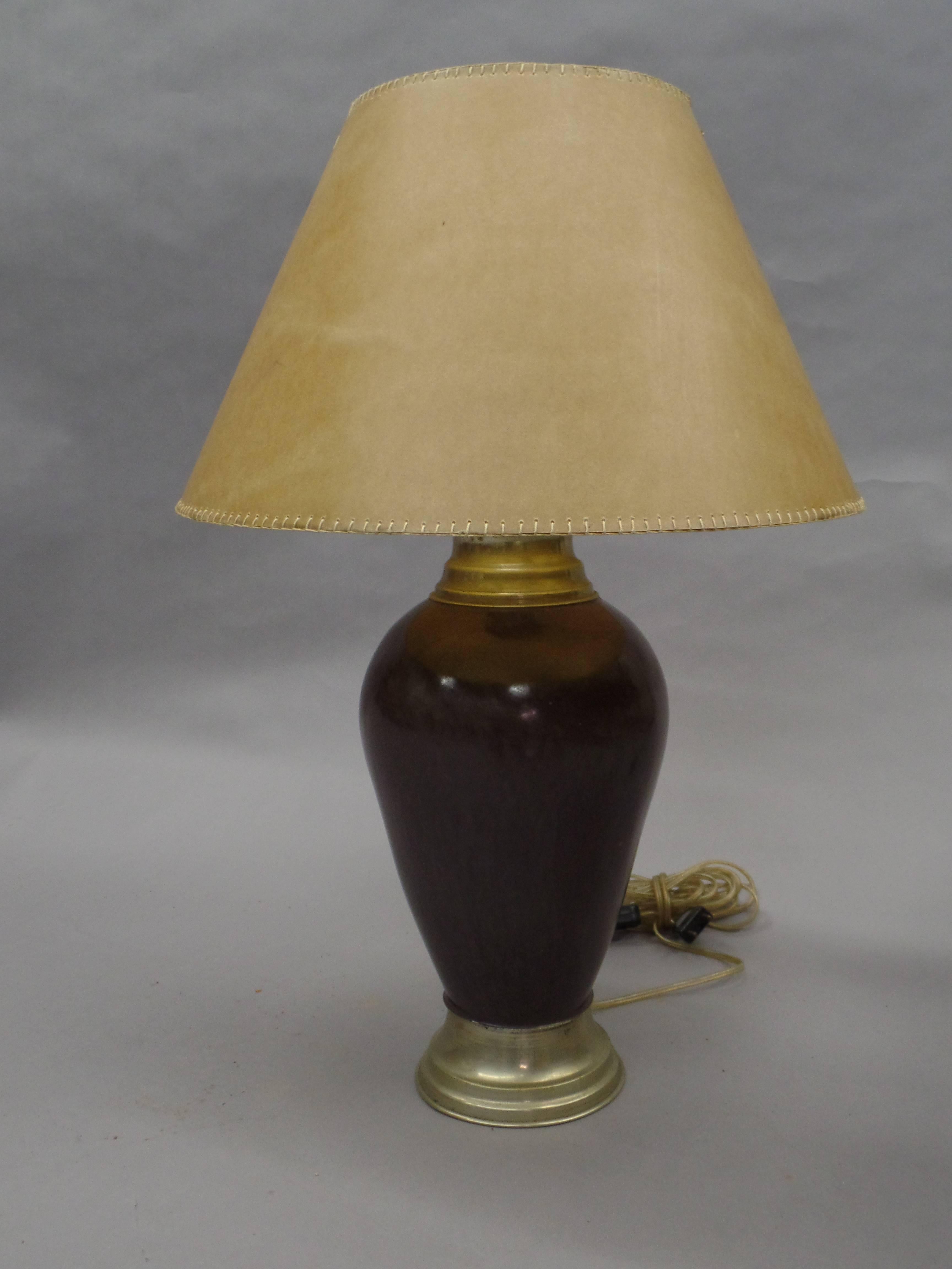 A sober pair of French Mid-Century table lamps in enameled Steel with steel bases and details. Enameled bases alone are H 17 x D 8.

Shades shown are for demonstration purposes only.