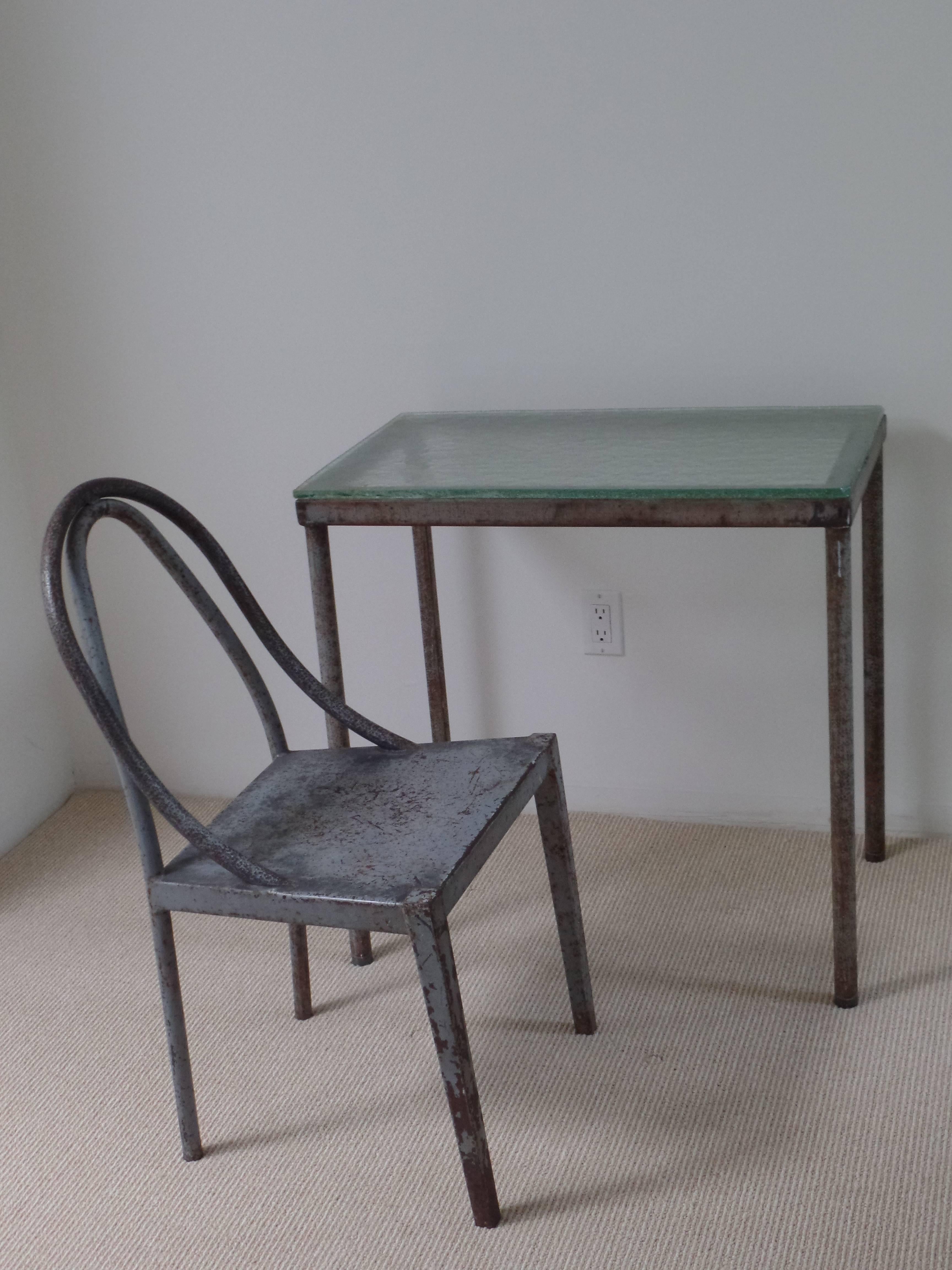 Rare handmade French modernist desk and chair prototypes in hand-formed and hand-hammered (non-commerially produced) tubular steel. The chair and desk are elegant architectural statements in their form and lines. Original top of sand-cast and steel
