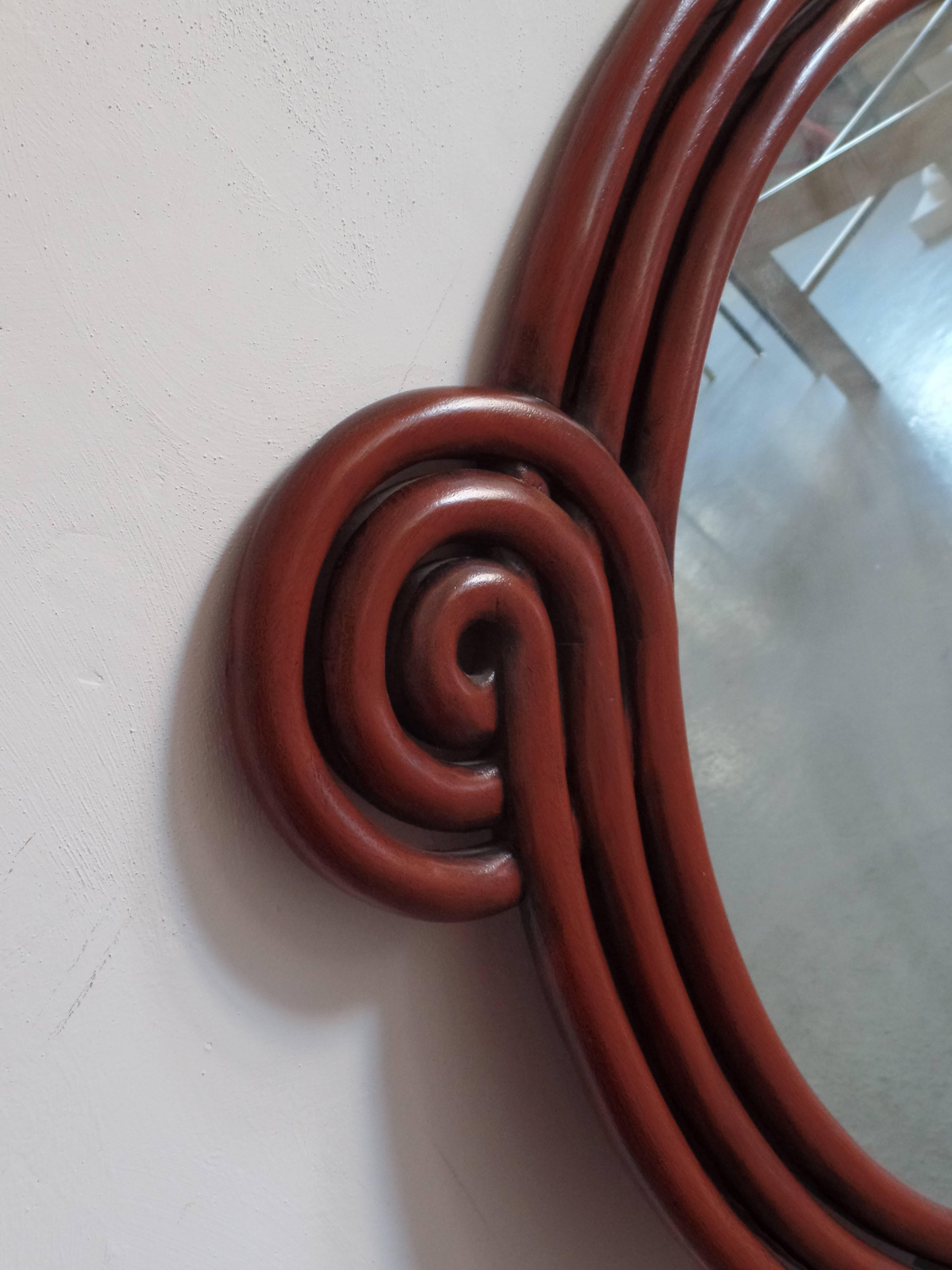 French Mid-Century Modern Carved Red Lacquer 'Perpetually Curving' Mirror, 1930 In Excellent Condition In New York, NY
