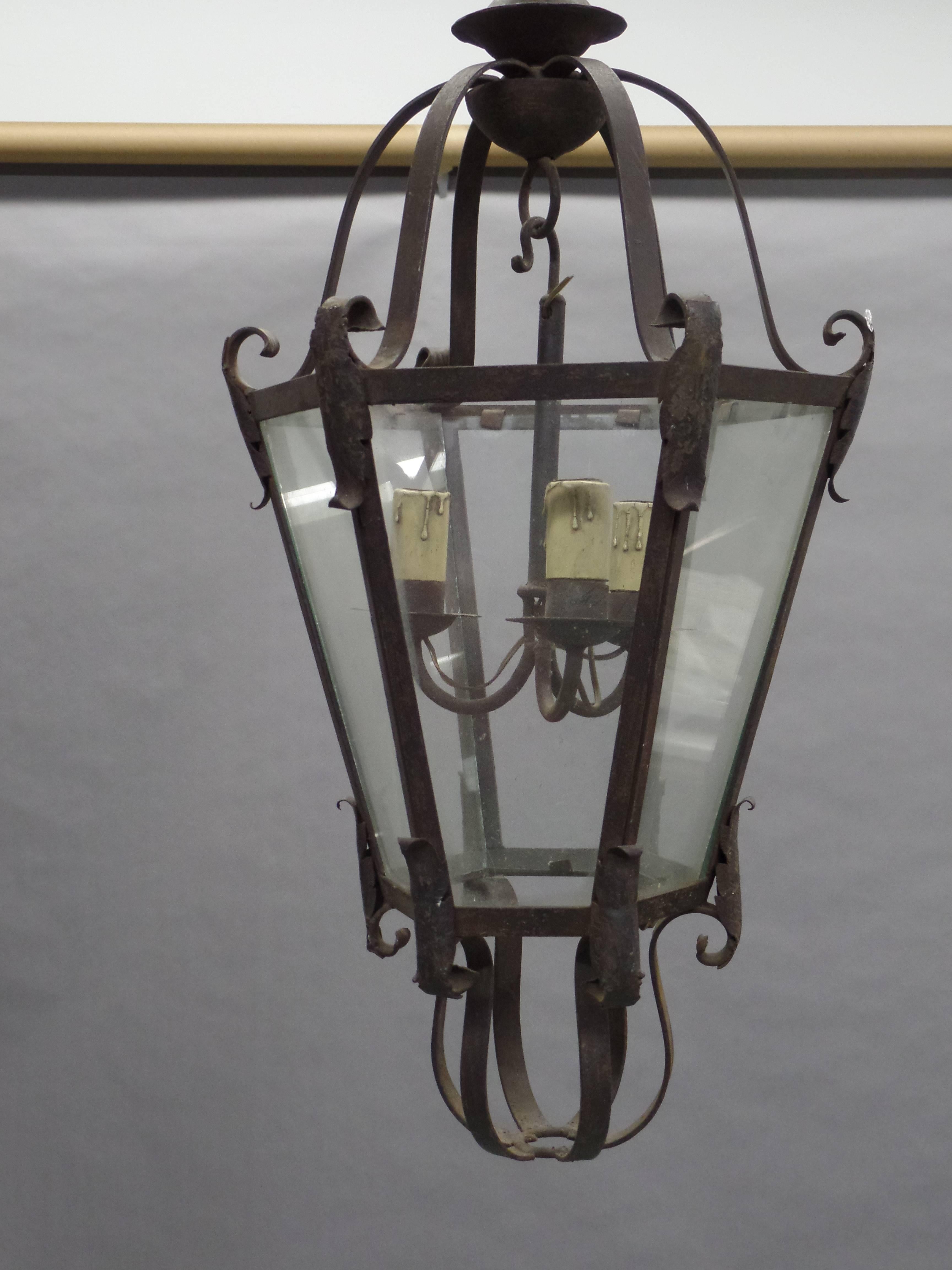 French Mid-Century hand-wrought iron lantern in a spare, modern traditional style.