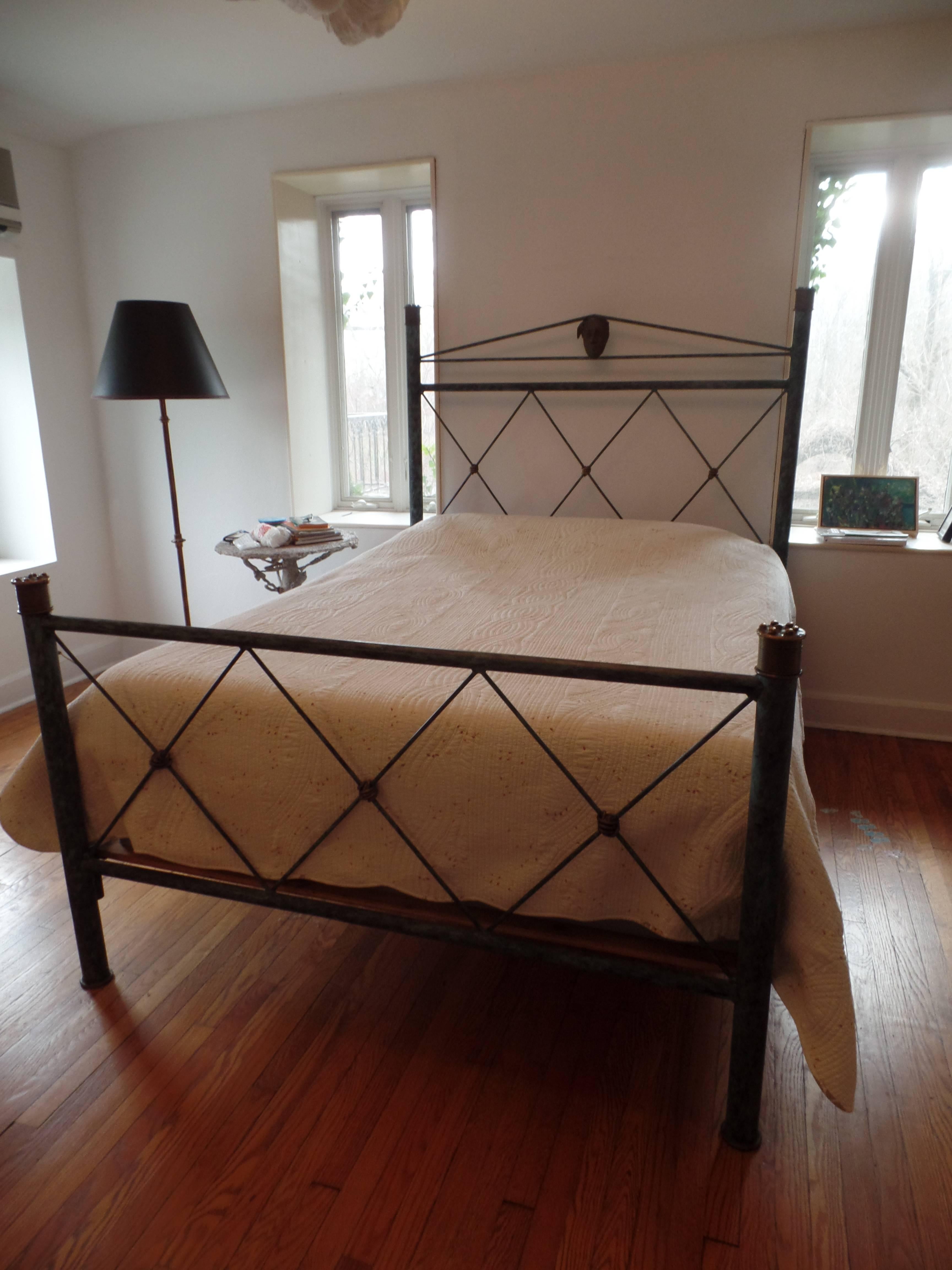 Elegant, timeless hand hammered wrought iron and gilt bronze queen size bed in the modern neoclassical tradition by Mario Villa

The frame is a patinated wrought iron. The details of the bed are in gilt bronze including the face of Josephine (the