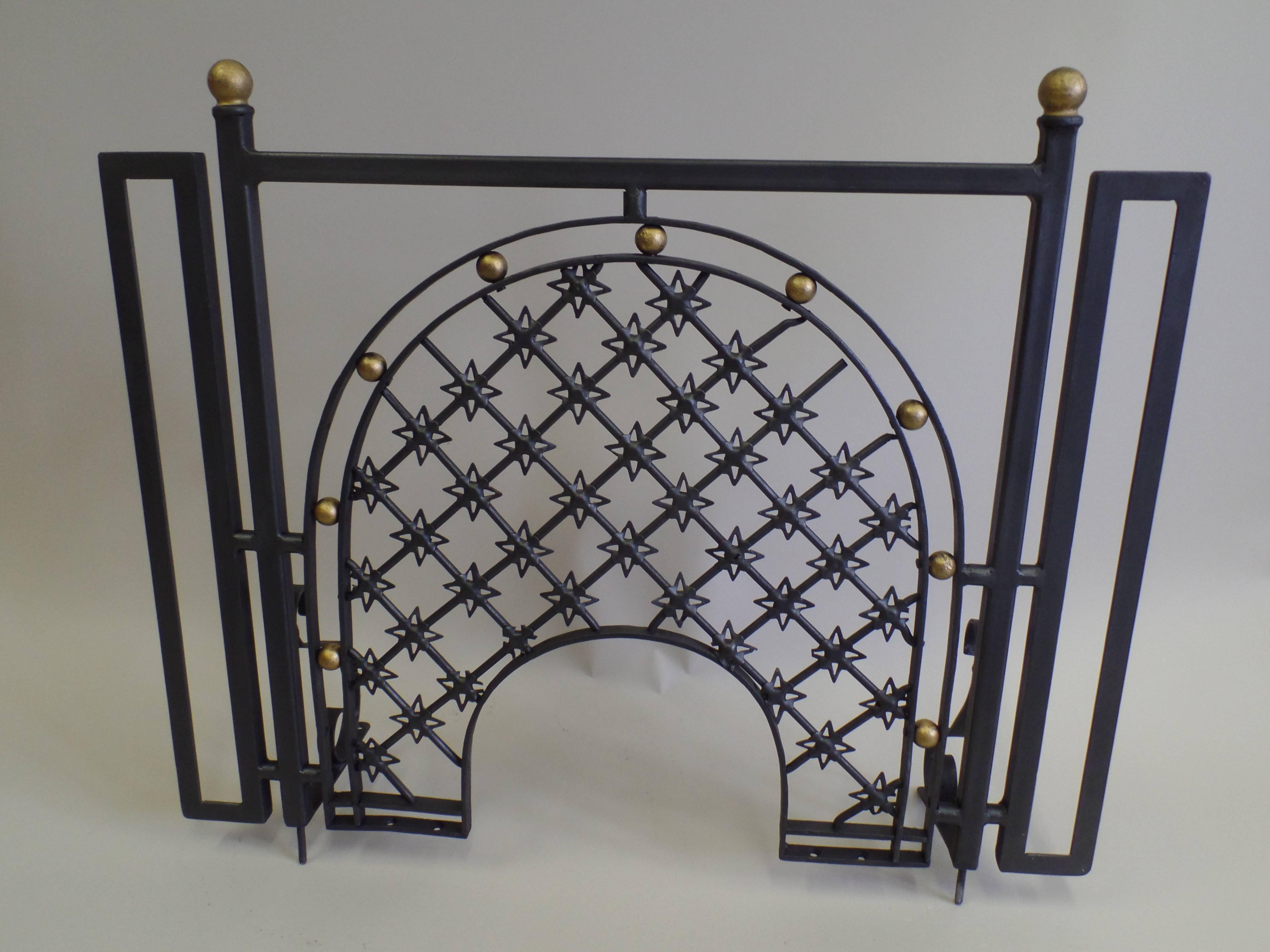 Pair of French Mid-Century Modern Neoclassical Firescreens attributed to French master iron worker, Gilbert Poillerat. The screens are delicately fabricated with a sober, linear frame with the central part of the screen decorated in the form of